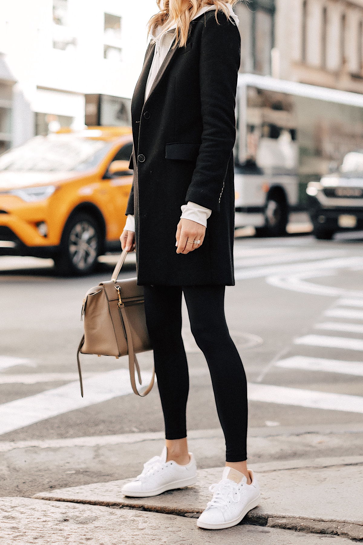Fashion Jackson Wearing Black Wool Coat Grey Hoodie Black Leggings adidas white Stan Smith Sneakers NYC Street Style