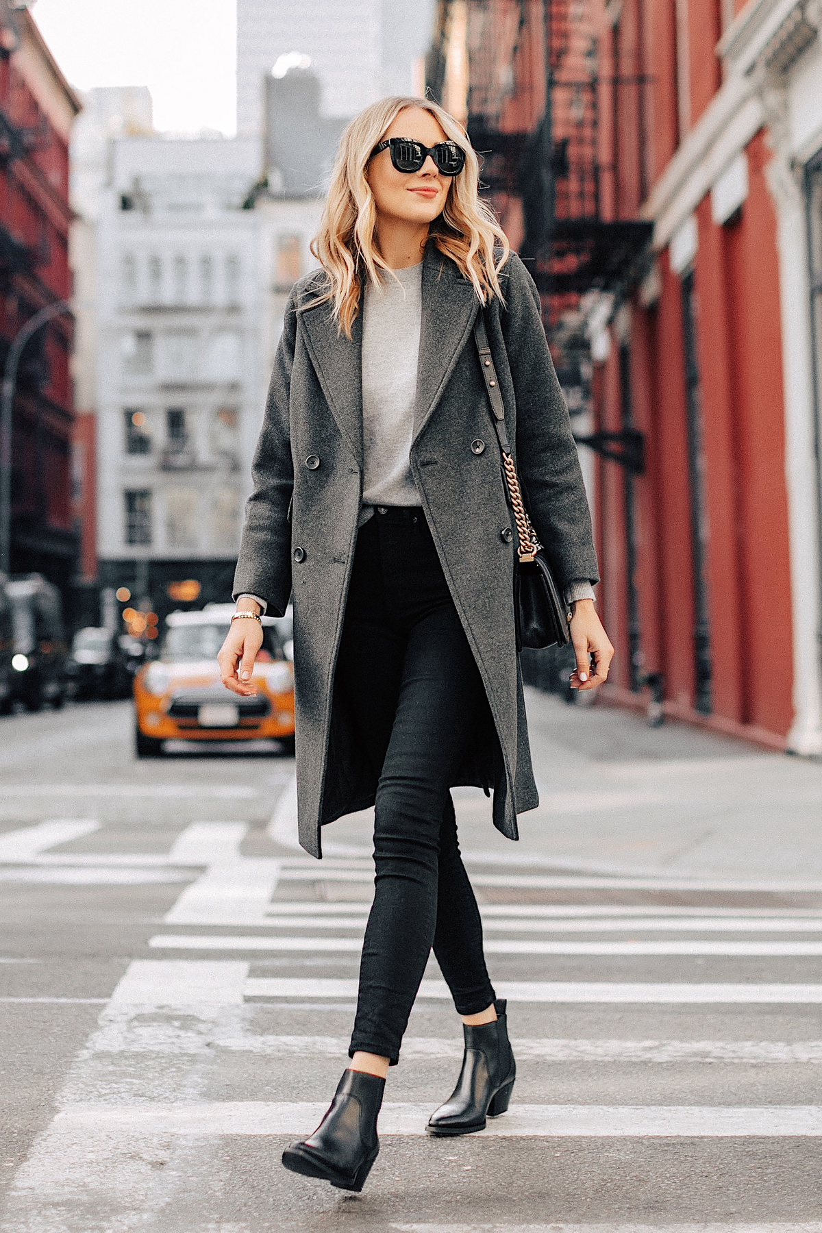 Fashion Jackson Wearing Grey Everlane Wool Overcoat Grey Sweater Black Skinny Jeans Black Booties New York City Street Style