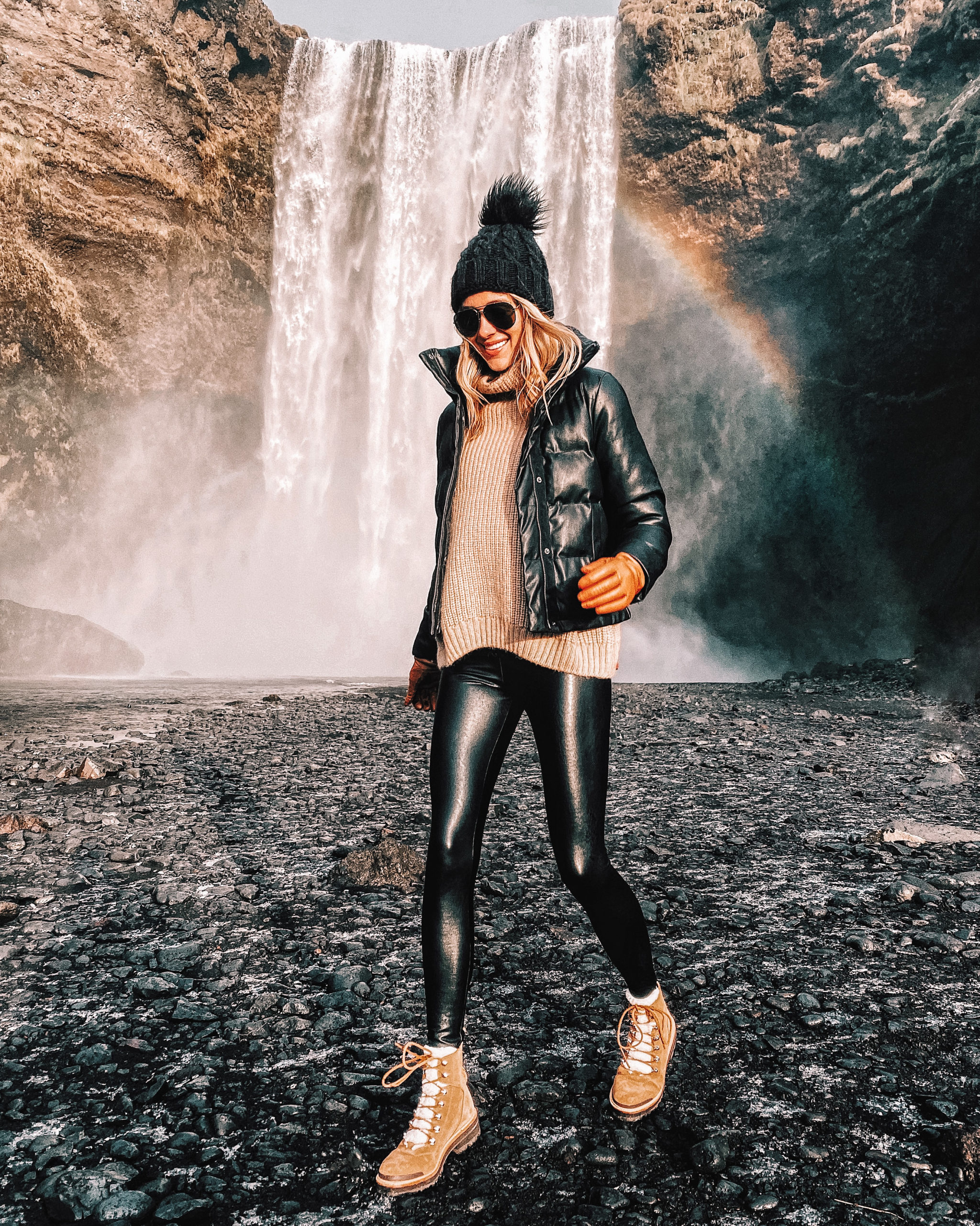 Fashion Jackson Wearing Faux Leather Puffer Jacket Camel Sweater Black Faux Leather Leggings Winter Boots Iceland