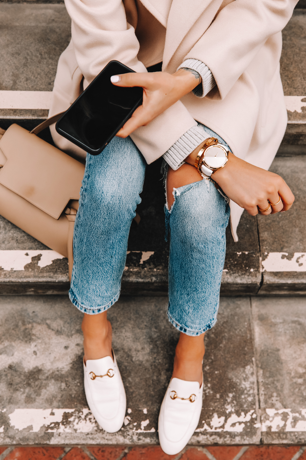 Fashion Jackson Wearing Garmin Vivomove Luxe White Watch Ripped Jeans White Gucci Mules Beige Coat