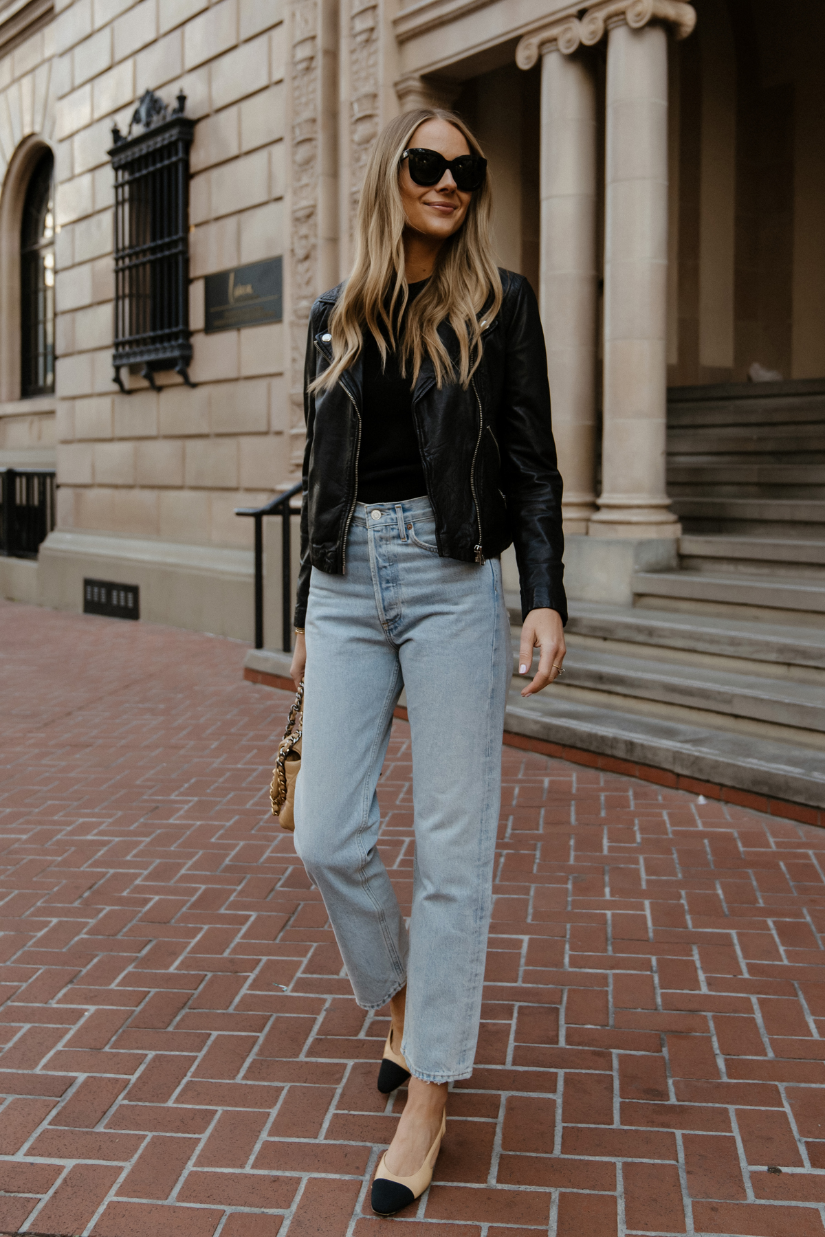 Fashion Jackson Wearing Madewell Black Leather Jacket AGOLDE 90s Jeans Outfit Womens Black Leather Jacket Outfit Chanel Slingbacks Street Style 1