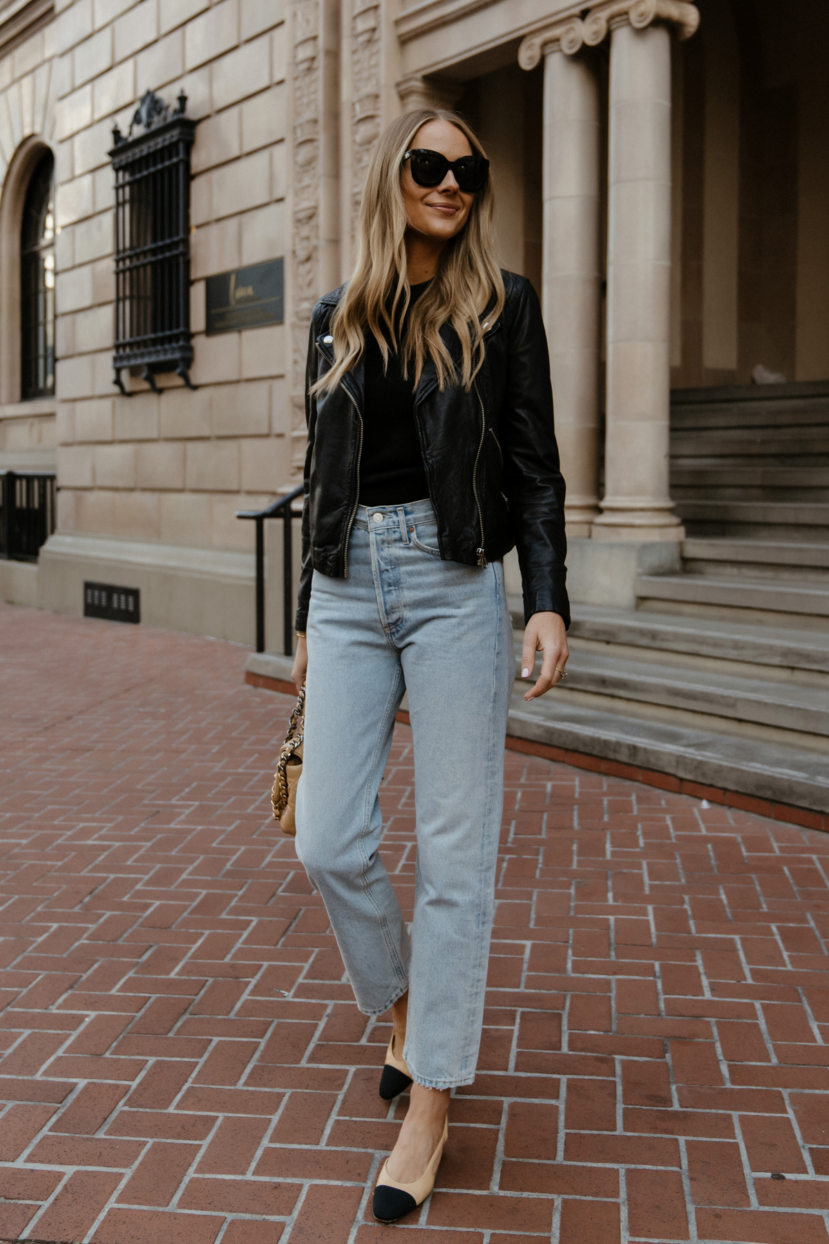 https://fashionjackson.com/wp-content/uploads/2020/01/Fashion-Jackson-Wearing-Madewell-Black-Leather-Jacket-AGOLDE-90s-Jeans-Outfit-Womens-Black-Leather-Jacket-Outfit-Chanel-Slingbacks-Street-Style-1.jpg