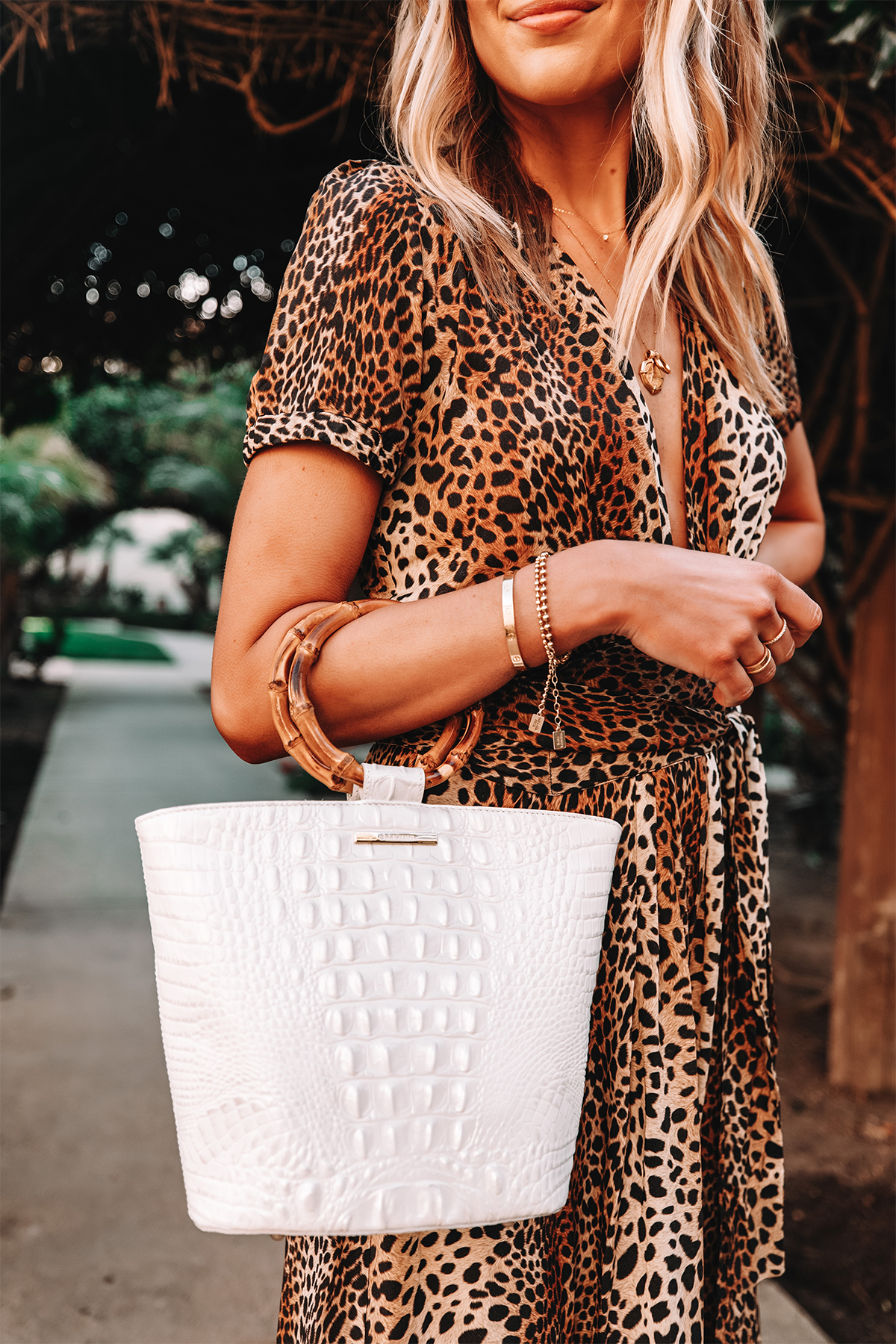 Fashion Jackson Wearing Leopard Dress Holding Brahmin Mod Bowie Handbag in White