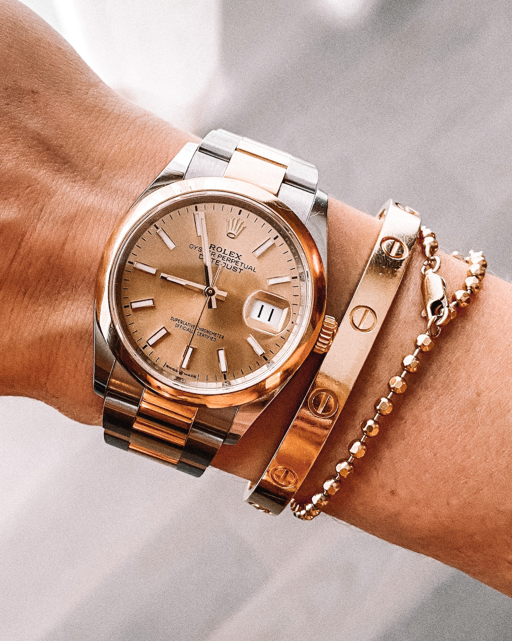 cartier love bracelet with rolex