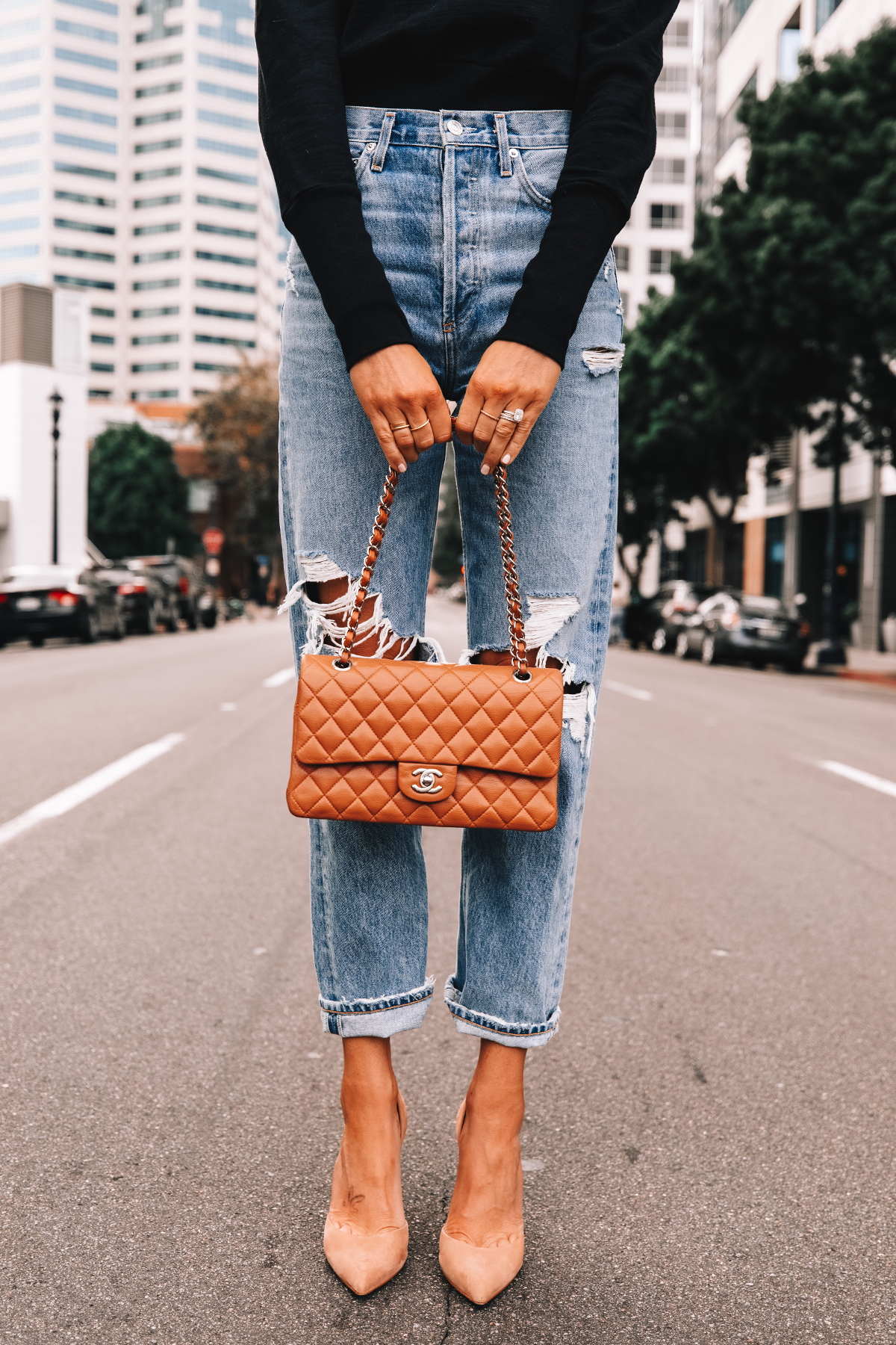 Fashion Jackson Wearing Black Sweatshirt AGOLDE Ripped Boyfriend Jeans Nude Pumps Chanel Medium Flap Camel Handbag