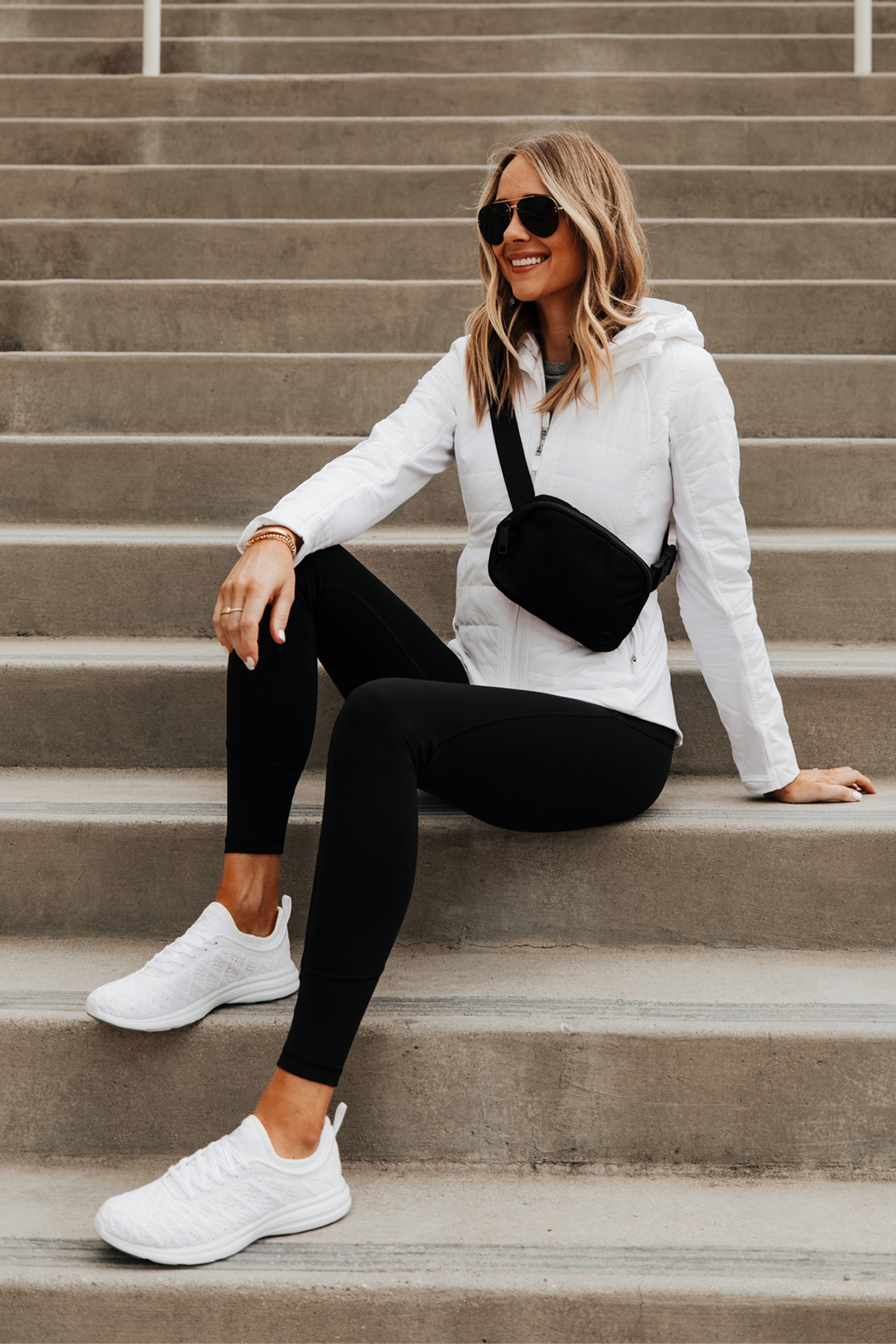 https://fashionjackson.com/wp-content/uploads/2020/03/Fashion-Jackson-Wearing-lululemon-white-zip-up-jacket-lululemon-another-mile-jacket-review-Black-Leggings-White-APL-Sneakers-Black-Belt-Bag.jpg