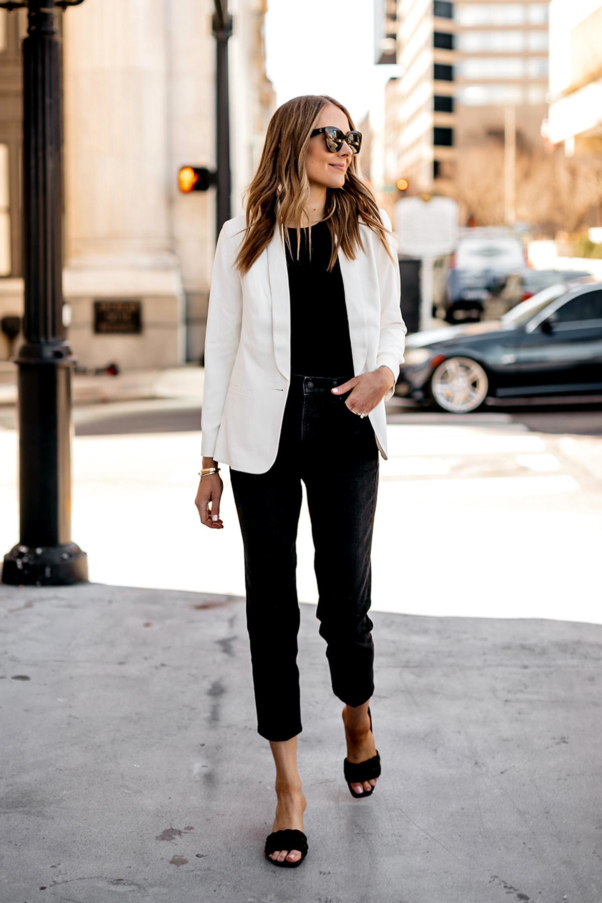 Fashion Jackson Wearing Express White Blazer Black Bodysuit Black Jeans Black Heeled Sandals Modern Workwear Outfit 2