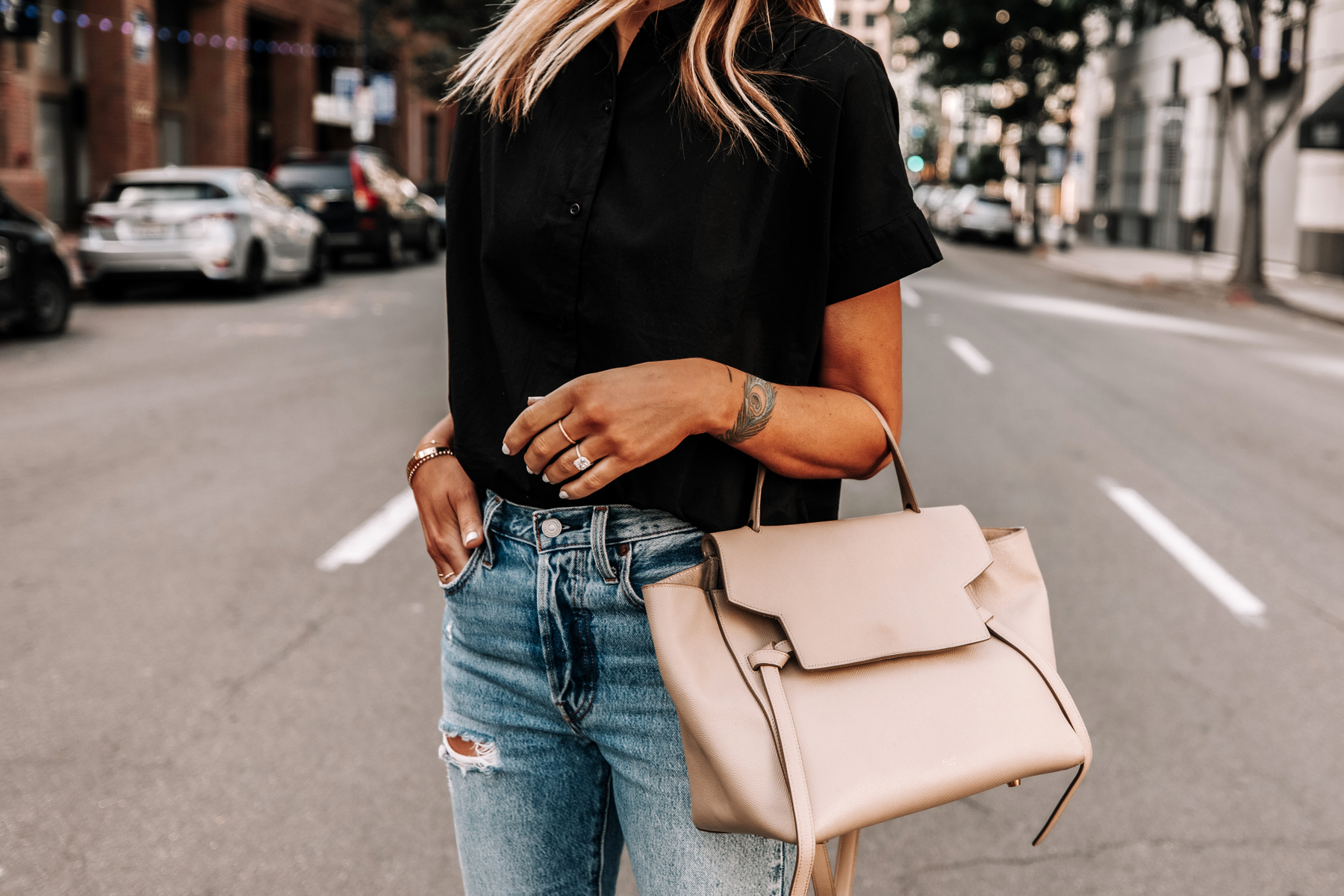 Fashion Jackson Wearing Everlane Black Short Sleeve Button Down Shirt Ripped Jeans Celine Mini Belt Bag