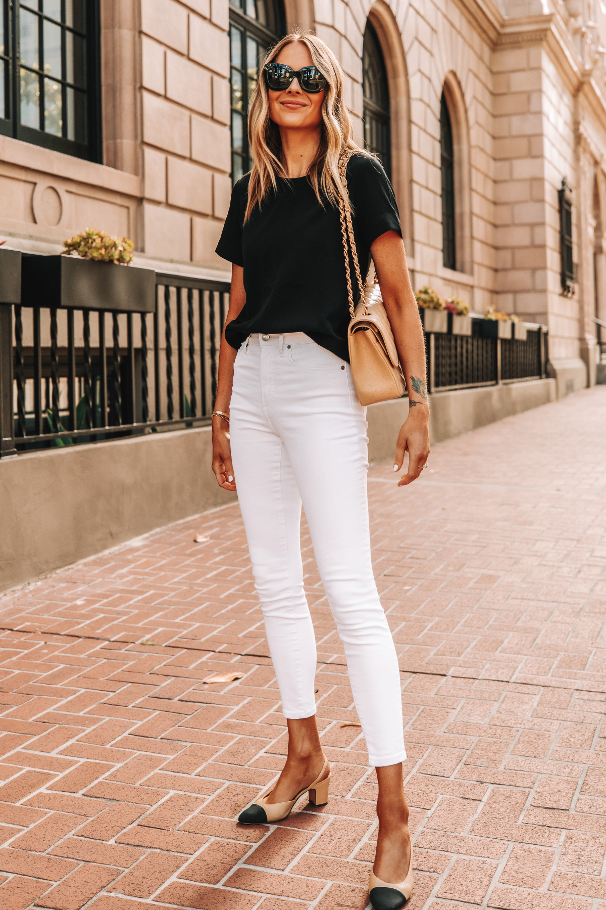 Fashion Jackson Wearing Everlane Black Short Sleeve Top Everlane White High Rise Skinny Jeans Chanel Slingbacks Chanel Beige Handbag 1