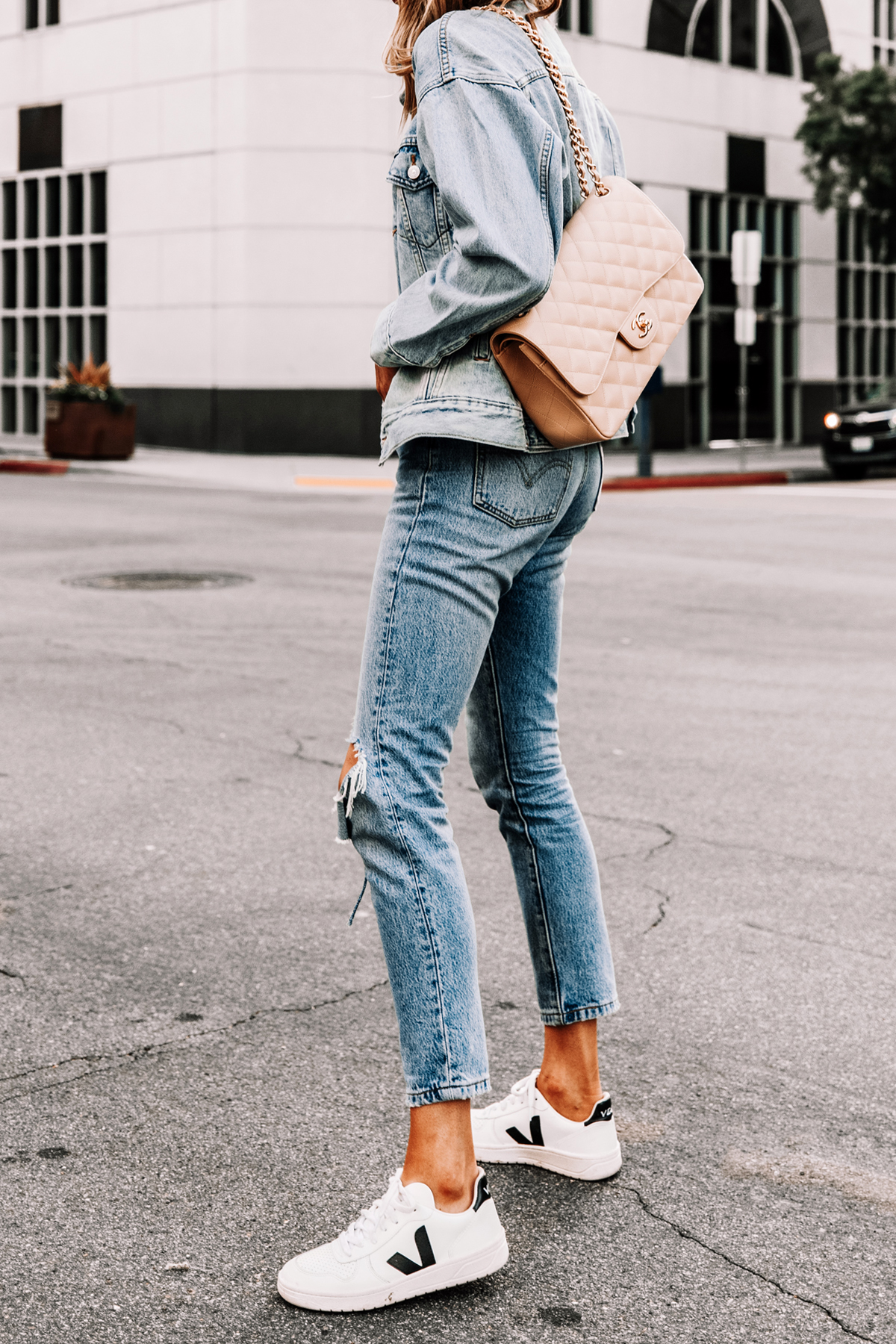 Fashion Jackson Wearing Levis Dad Trucker Jacket in Dad Michael Levis 501 Ripped Jeans Beige Chanel Jumbo Handbag