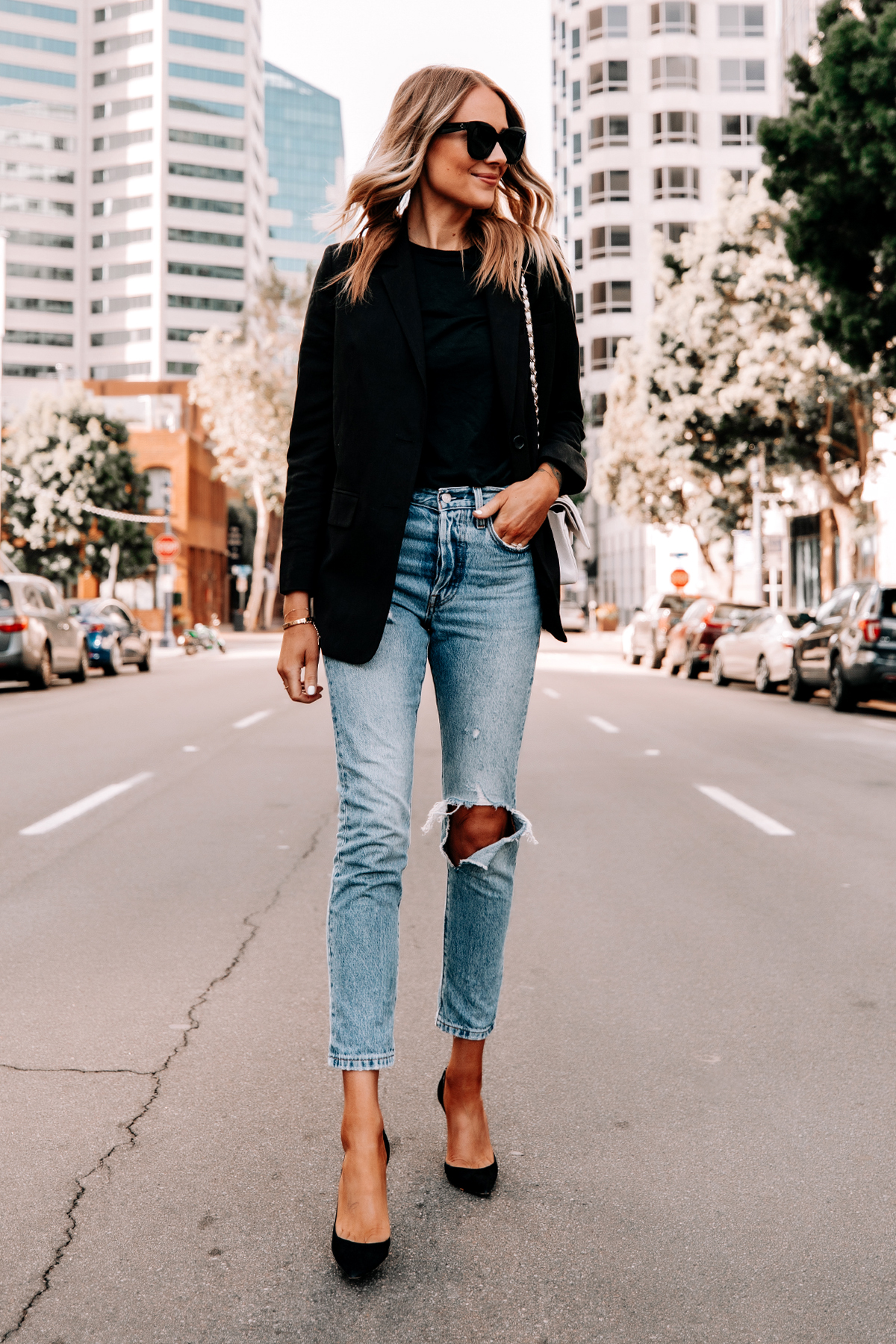 Premium Photo | Young caucasian woman in white t-shirt, black leather jacket  and blue jeans at coridor with windows