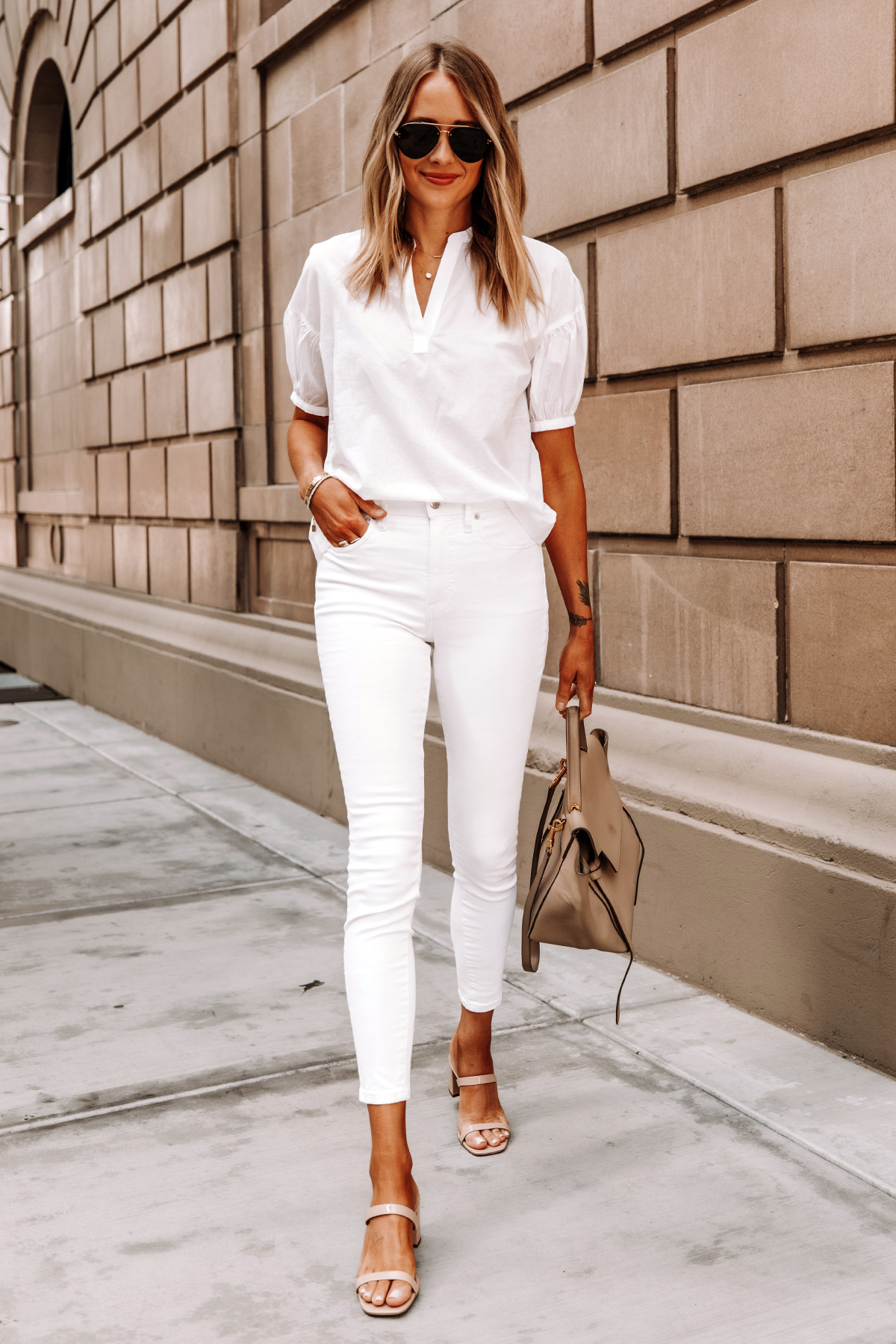 Fashion Jackson Wearing Everlane White Top Everlane White Skinny Jeans Tan Sandals Celine Belt Bag