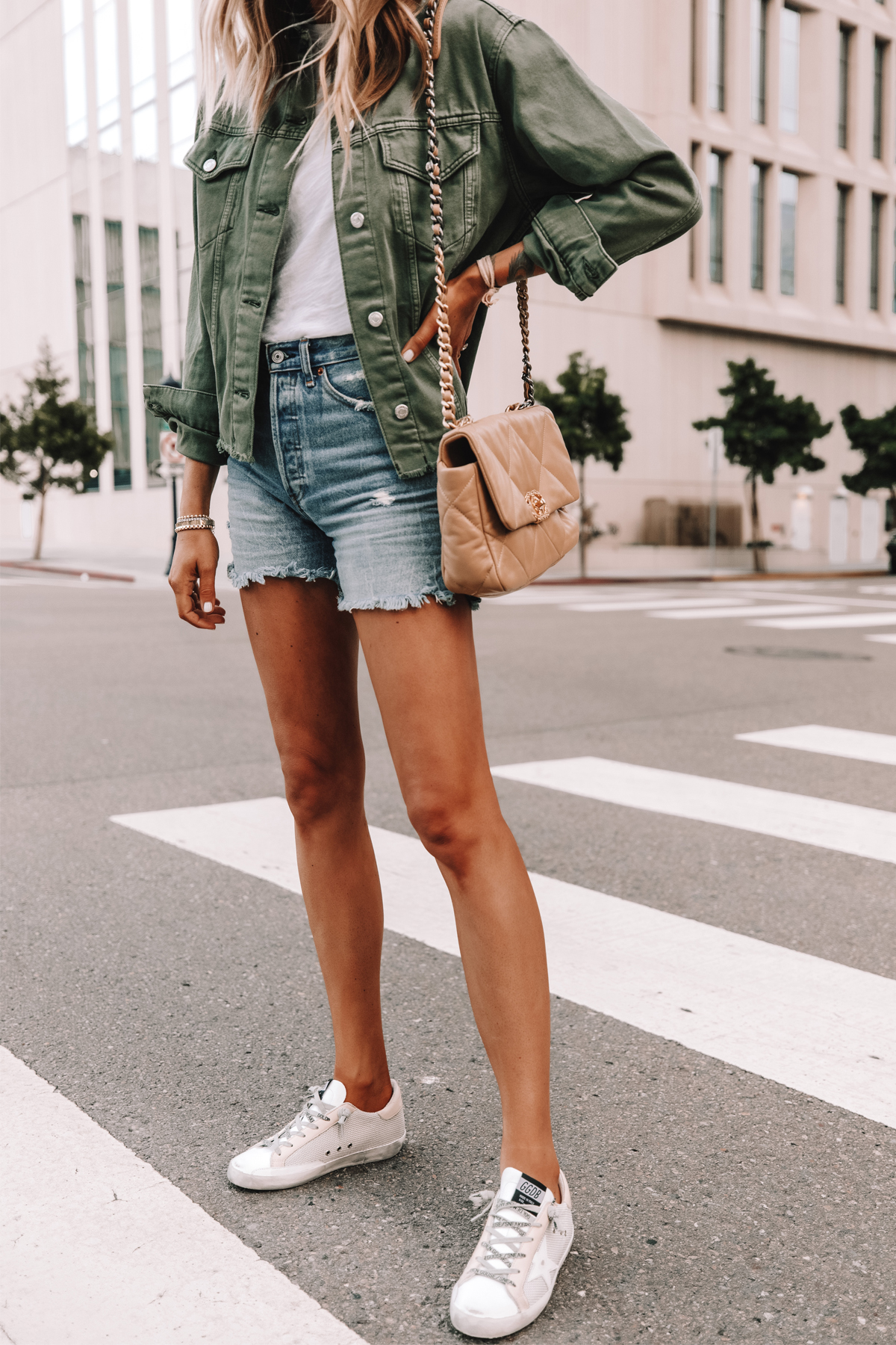 Fashion Jackson Wearing Topshop Olive Green Denim Jacket White Tshirt Ripped Denim Shorts Golden Goose Sneakers Chanel 19 Beige Handbag 3