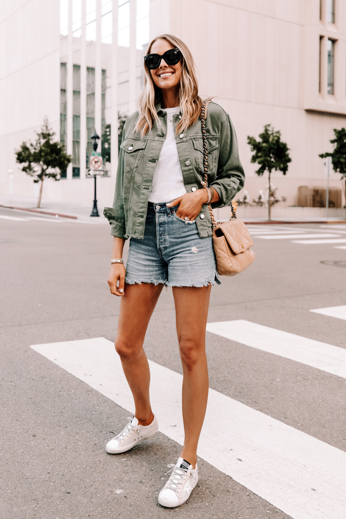 Fashion Jackson Wearing Topshop Olive Green Denim Jacket White Tshirt Ripped Jean Shorts Golden Goose Superstar Sneakers Chanel 19 Beige Handbag 1