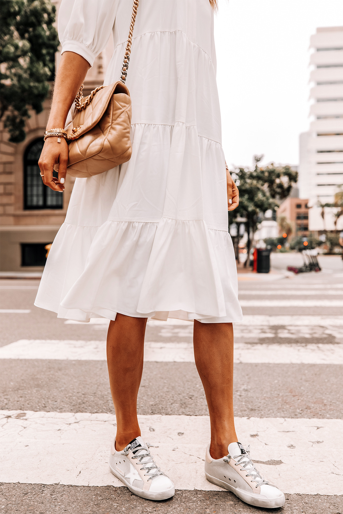 Fashion Jackson Wearing White Tiered Midi Dress Golden Goose Sneakers