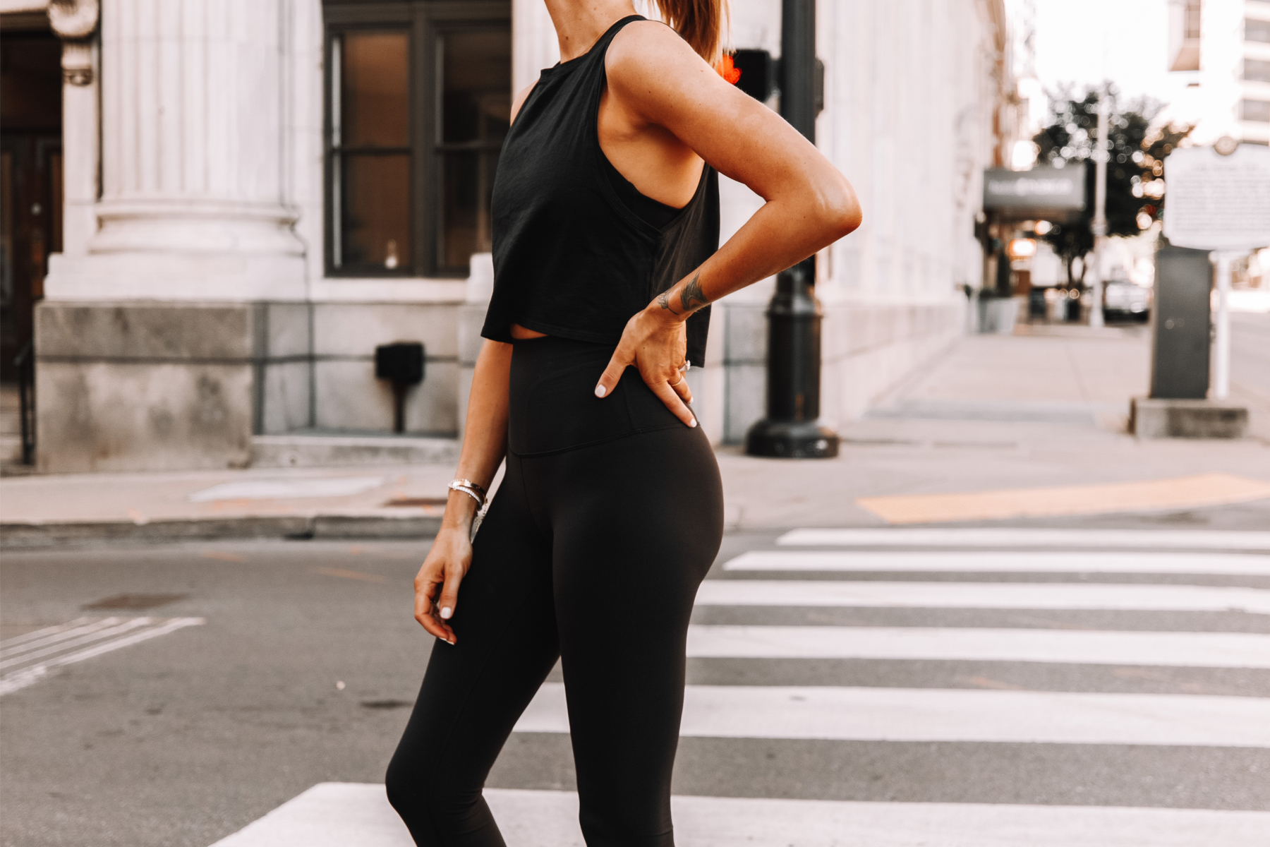 https://fashionjackson.com/wp-content/uploads/2020/07/Fashion-Jackson-Wearing-lululemon-Black-Cut-Back-Crop-Tank-Black-Leggings-2.jpg