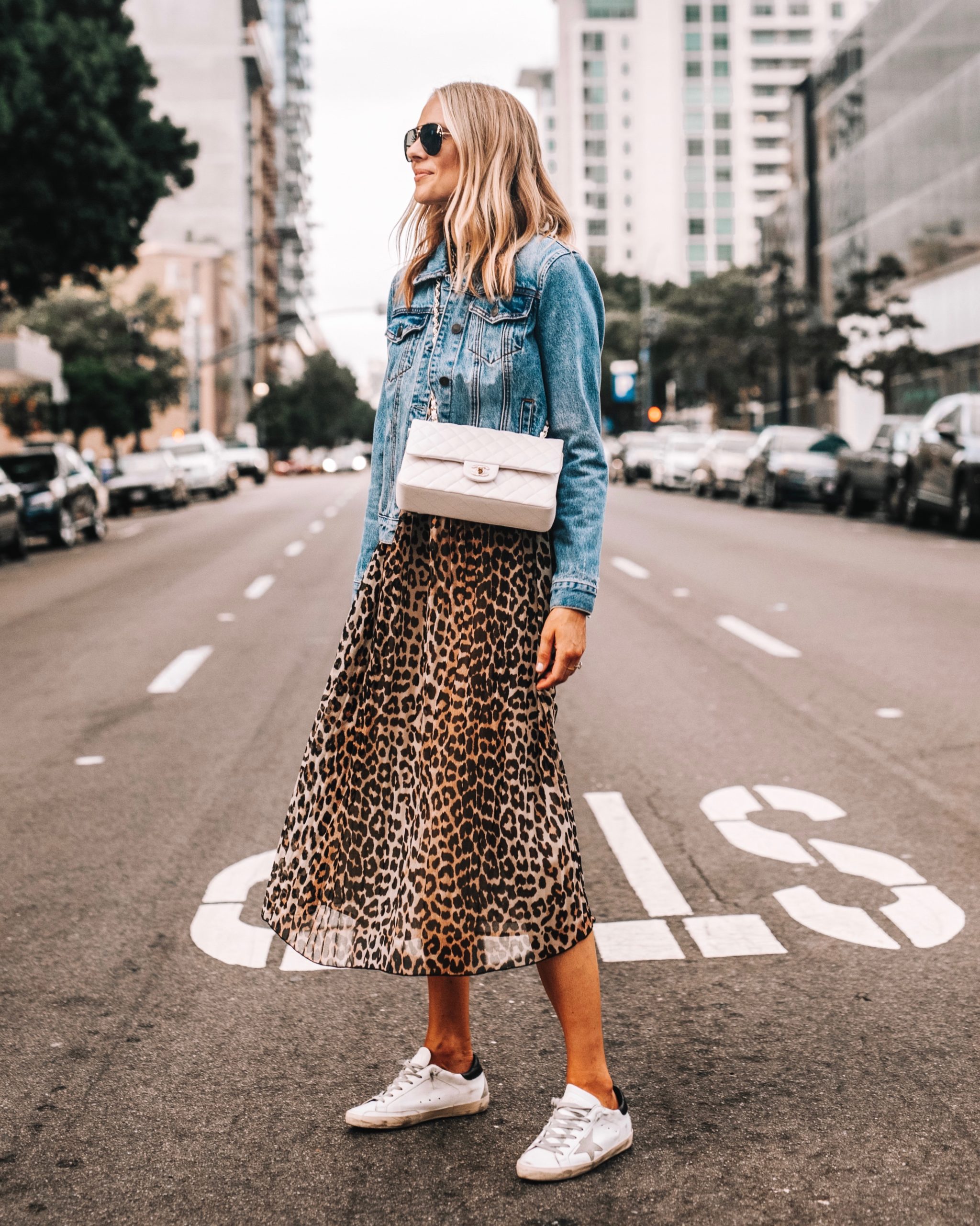 denim jacket with dress and sneakers