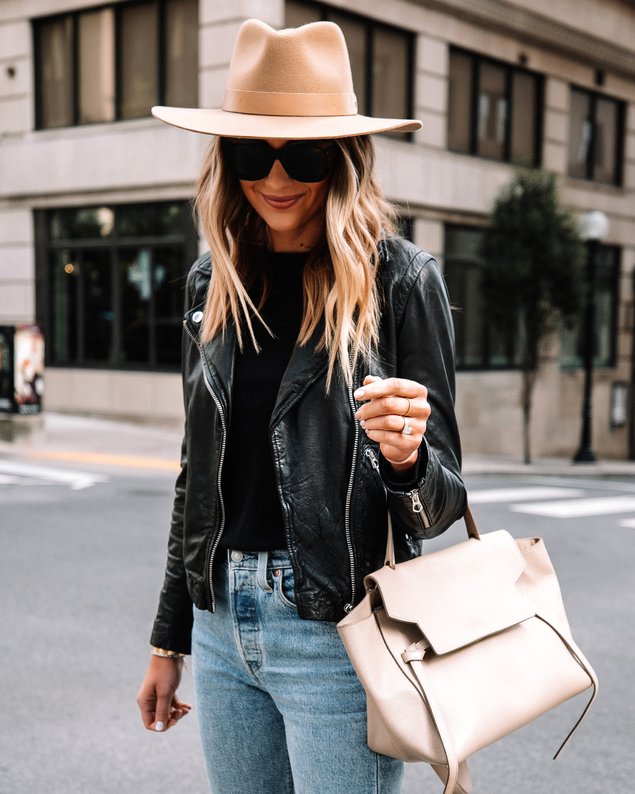 Fashion Jackson Wearing Madewell Black Leather Jacket Black Sweater Levis Jeans Rag and Bone Fall Hat Celine Belt Bag