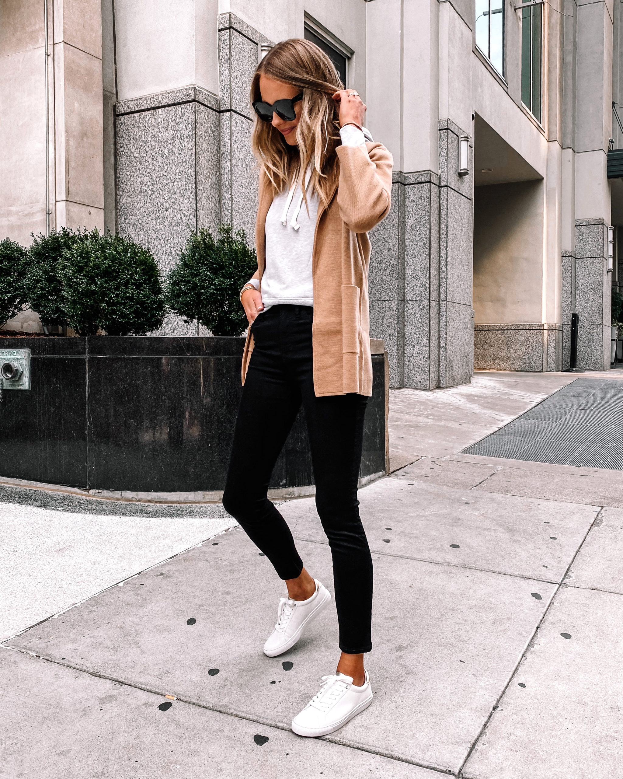 Stylish young man in a denim jacket, a gray T-shirt and black jeans in white  shoes on the street Stock Photo | Adobe Stock