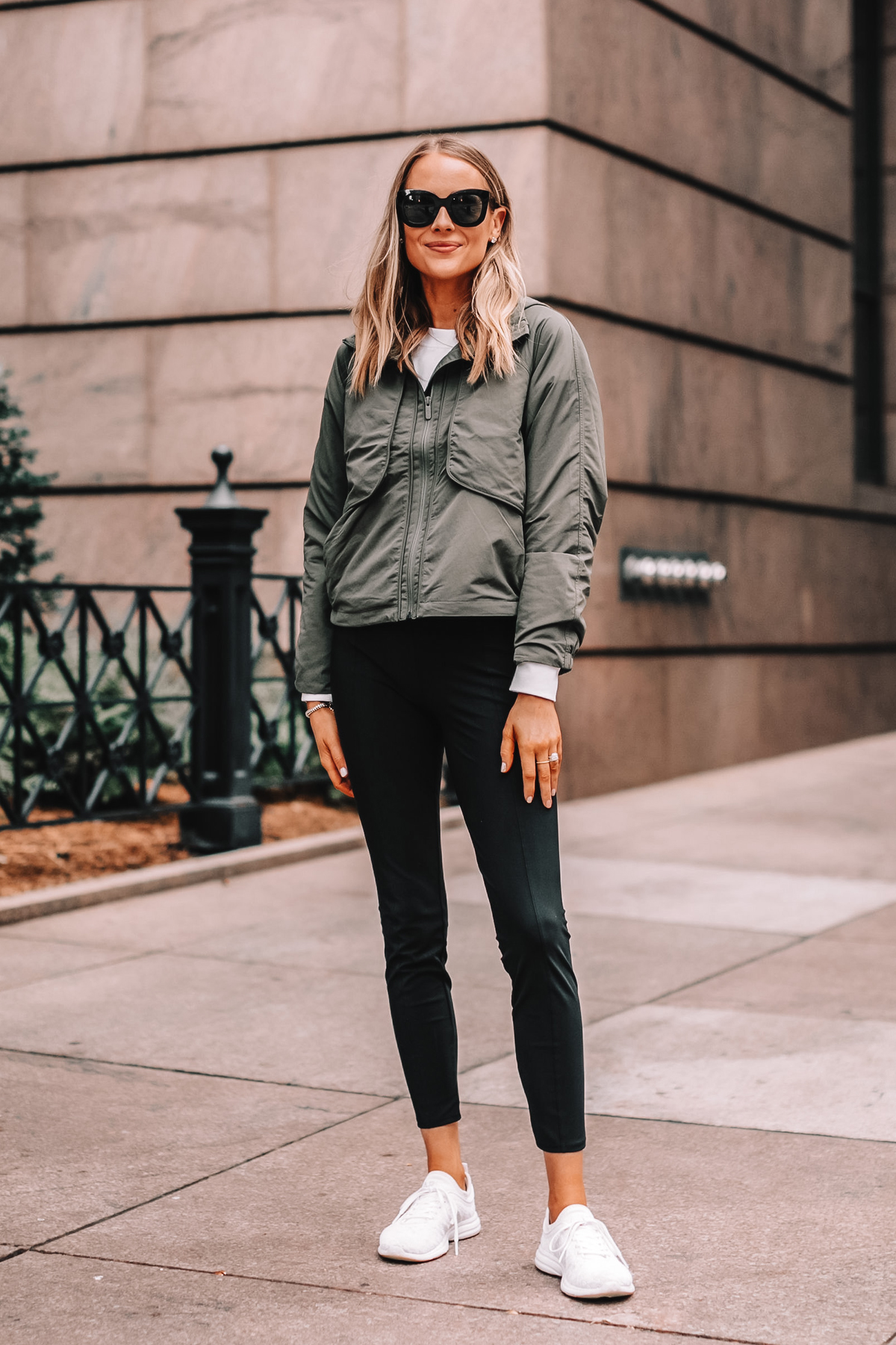 Effortless Street Style with Leather Pants and White Sneakers