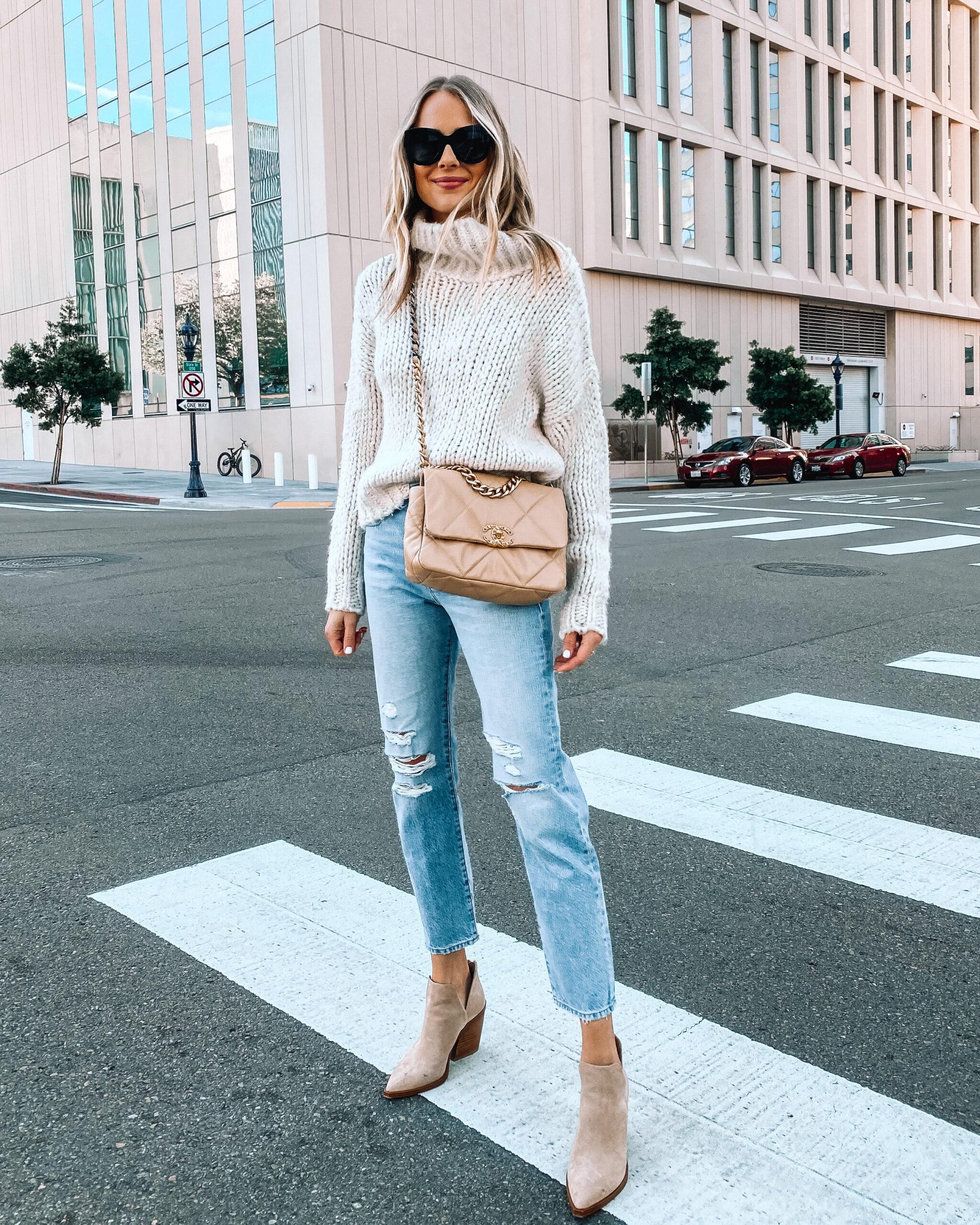 Fashion Jackson Wearing Beige Turtleneck Sweater Ripped Jeans Chanel 19 Beige Handbag Tan Booties