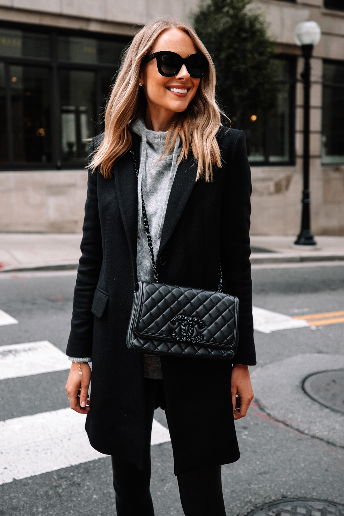 Fashion Jackson Wearing Black Wool Coat Grey Sweater Commando Black Faux Leather Leggings Black Chanel Filigree Handbag