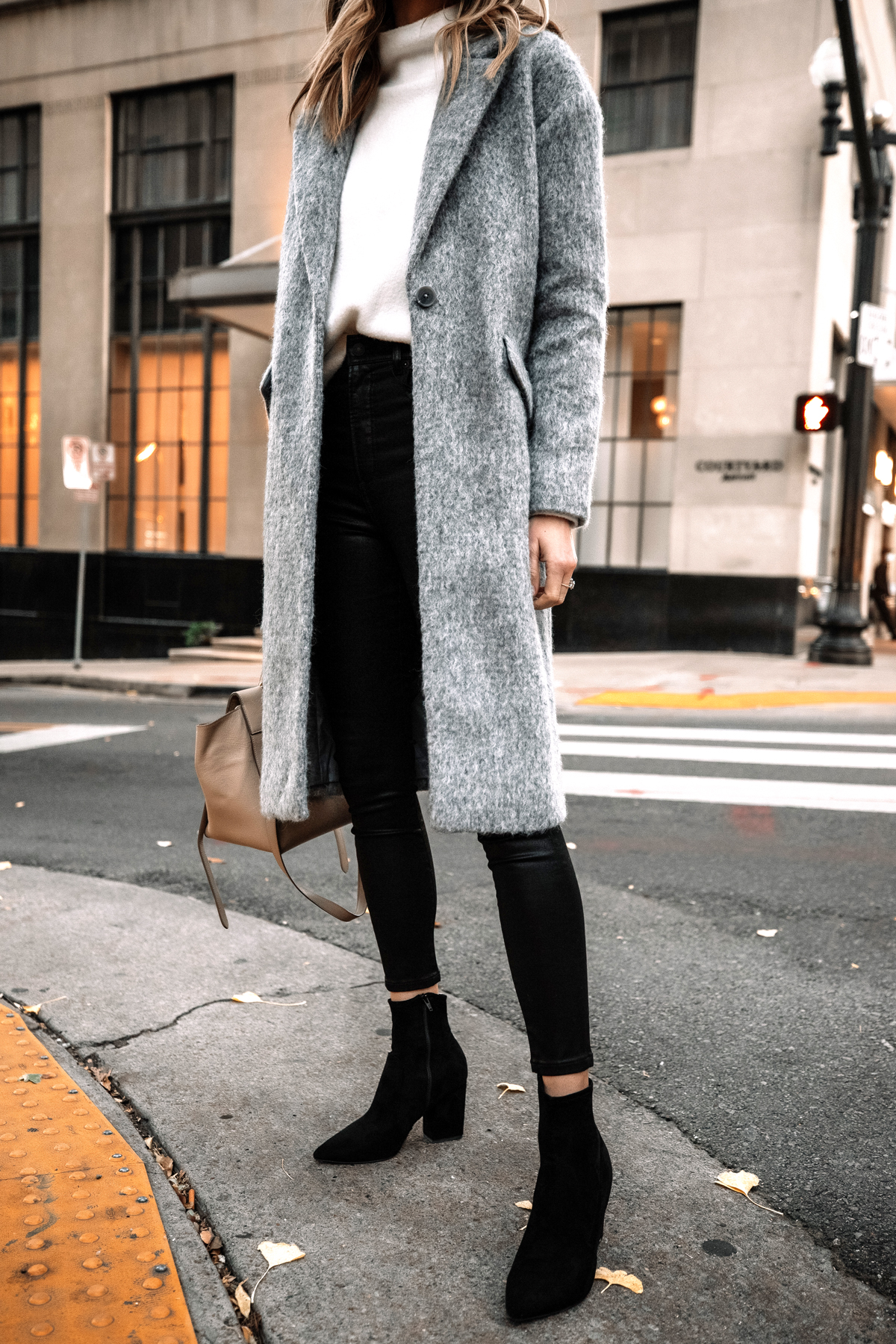 https://fashionjackson.com/wp-content/uploads/2020/11/Fashion-Jackson-Wearing-Express-Long-Grey-Coat-White-Sweater-Black-Coated-Skinny-Jeans-Black-Suede-Booties.jpg