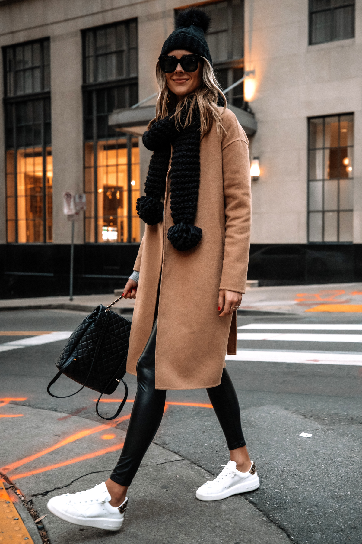 Fashion Jackson Wearing Express Camel Coat Faux Leather Leggings White Sneakers Black Scarf Black Beanie Street Style 2