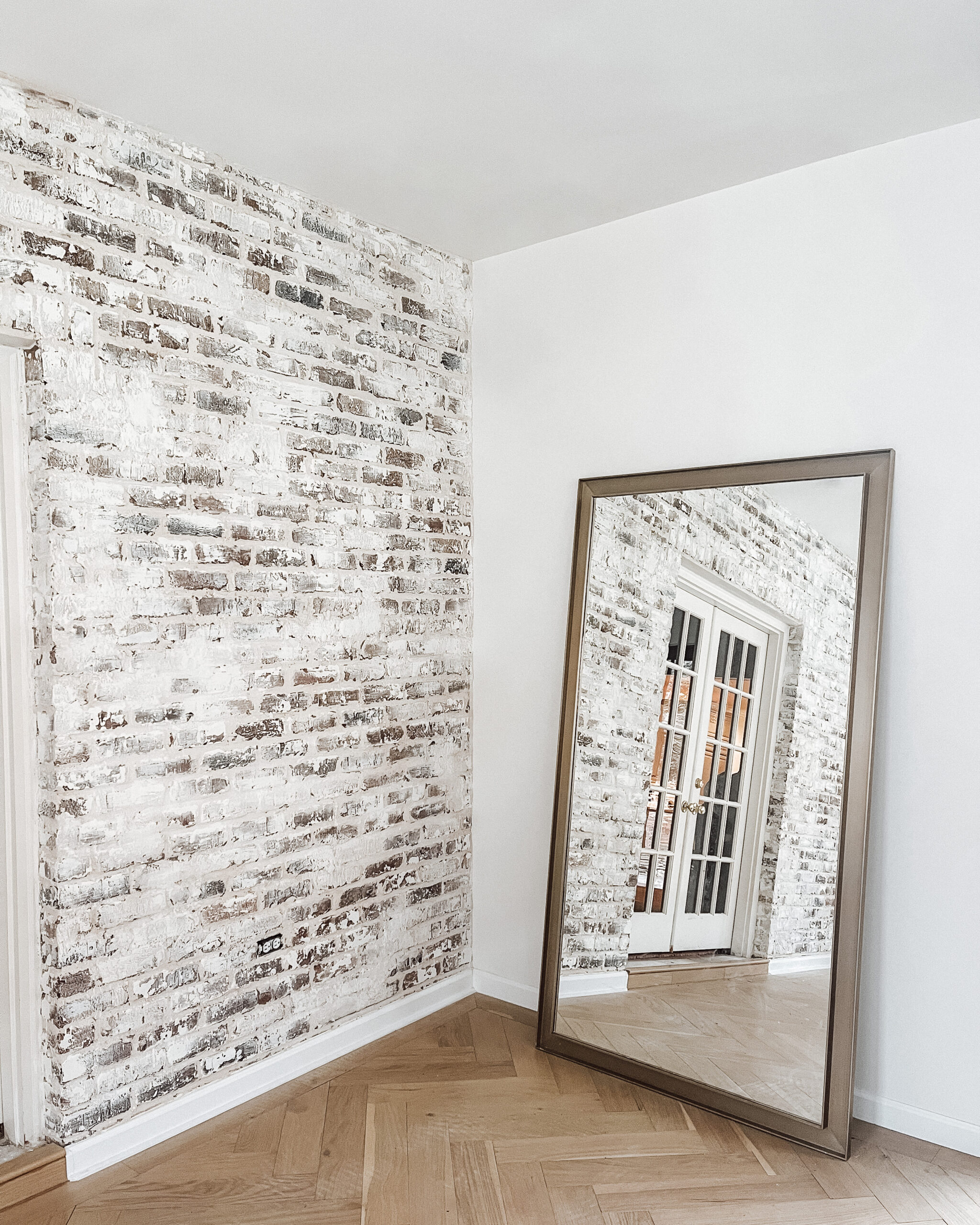 Emily Pope Harris White Brick Wall Renovation for Fashion Jackson