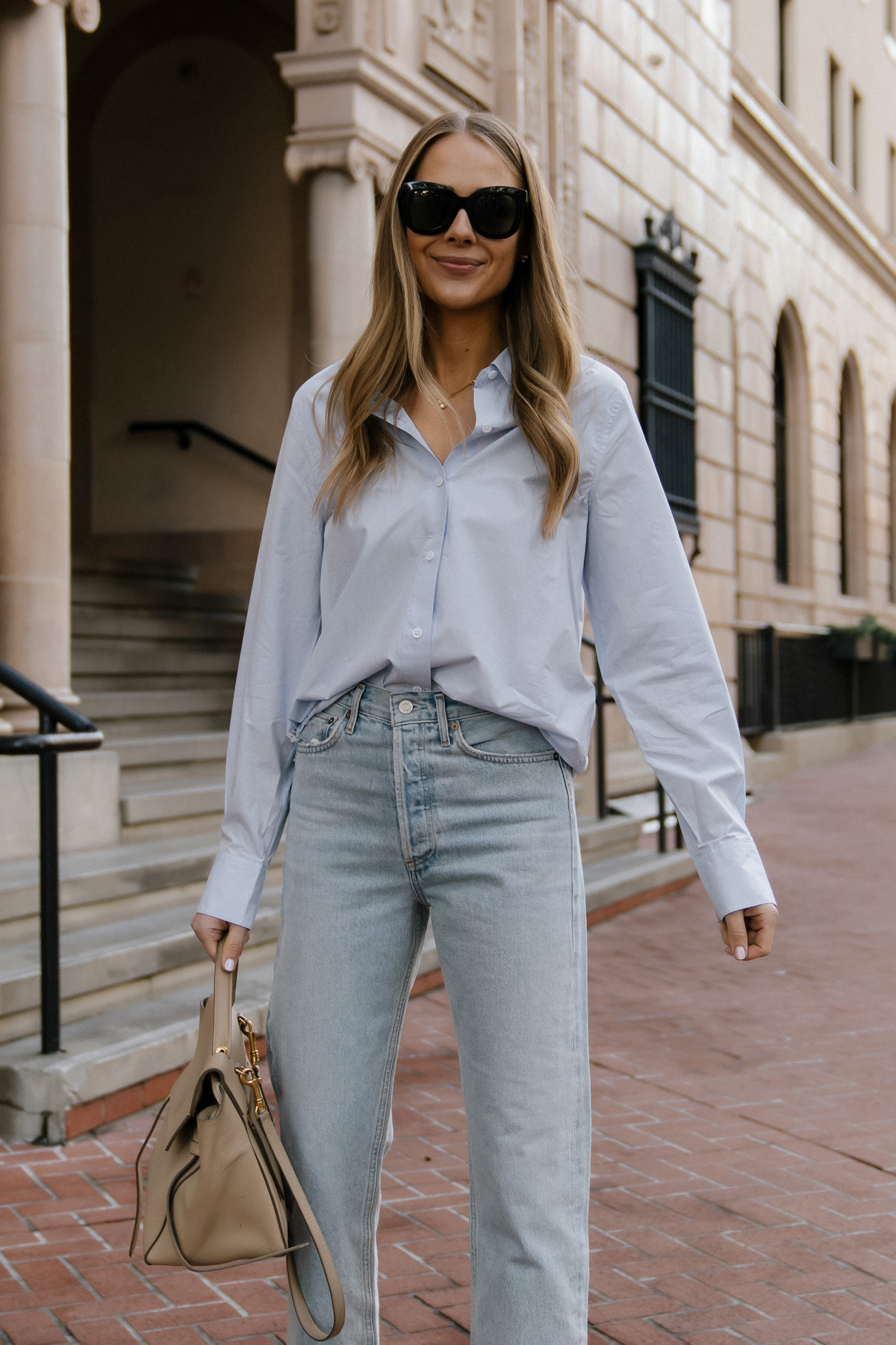 Fashion Jackson Wearing Jenni Kayne Blue Boyfriend Button Up Shirt AGOLDE  90s Loose Fit Jeans Nude Pumps Celine Belt Bag