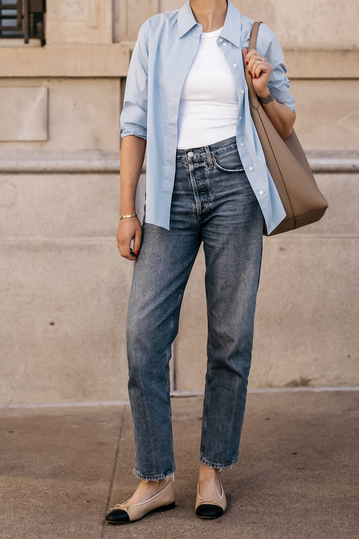 Fashion Jackson Wearing MAYSON the label Blue Button Up Shirt White Tank AGOLDE Jeans Chanel Ballerina Flats Tan and Black The Row NS Large Tote Taupe Casual Street Style Spring Outfit 2