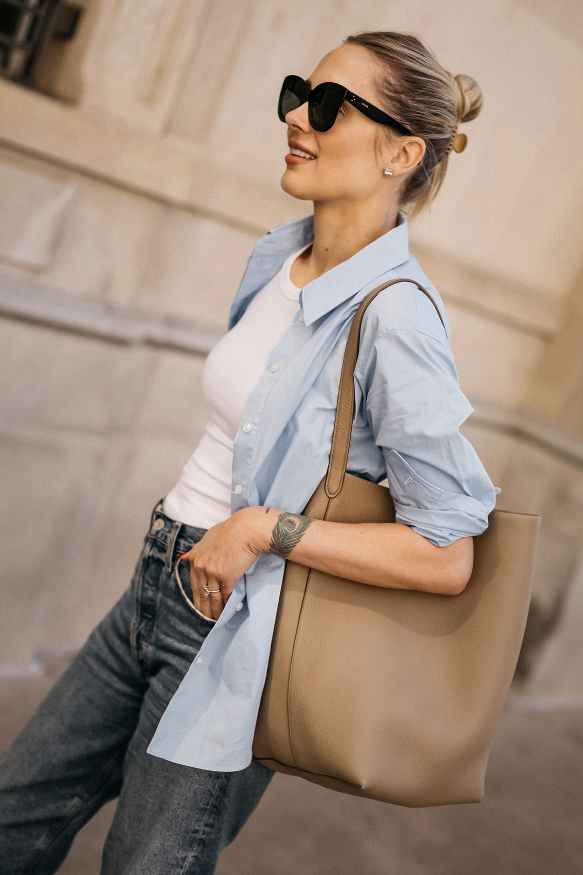 Fashion Jackson Wearing MAYSON the label Blue Button Up Shirt White Tank AGOLDE Jeans The Row NS Large Tote Taupe Casual Spring Outfit 1
