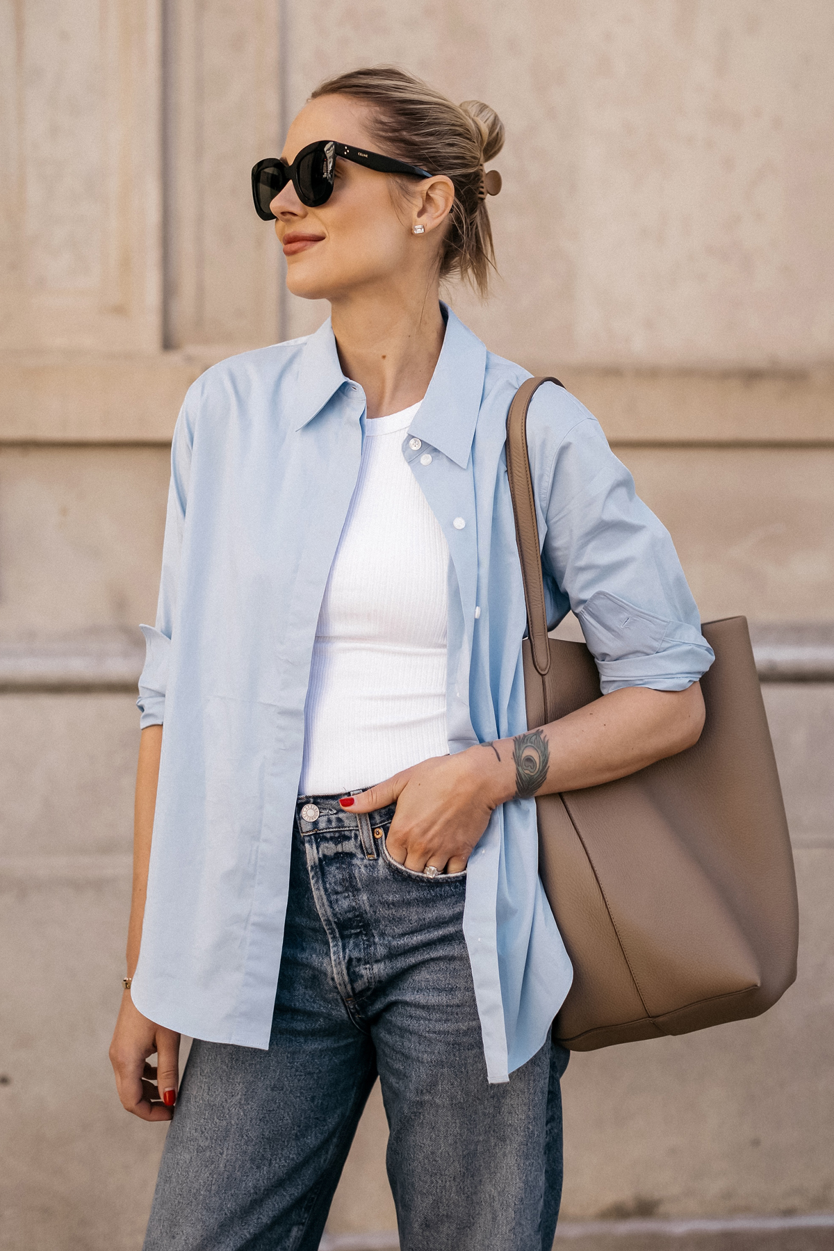 Fashion Jackson Wearing MAYSON the label Blue Button Up Shirt White Tank AGOLDE Jeans The Row NS Large Tote Taupe Casual Spring Outfit