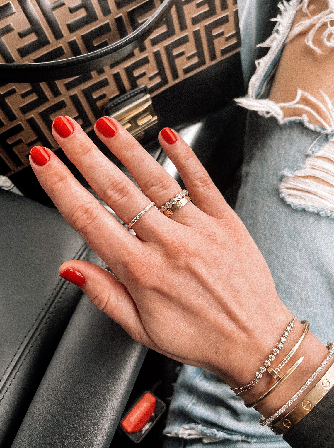 Fashion Jackson Red Gel Manicure Fendi Handbag Ripped Jeans Gold Cartier Bracelets Gold Stacking Rings