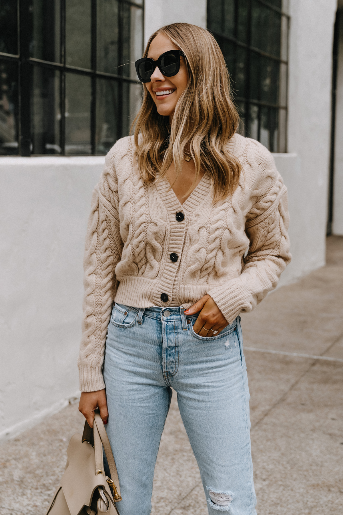 https://fashionjackson.com/wp-content/uploads/2021/10/Fashion-Jackson-Wearing-Vince-Cable-Knit-Cardigan-Levis-Jeans.jpg