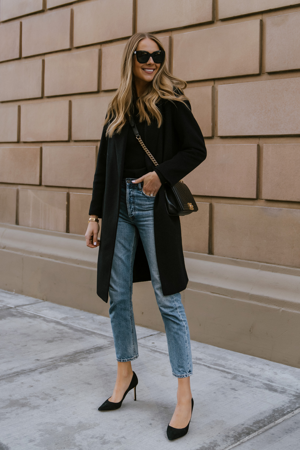 Fashion Jackson Wearing Vince Black Coat Black Sweater Denim Jeans Black Pumps womens black coat outfit Street Style 1