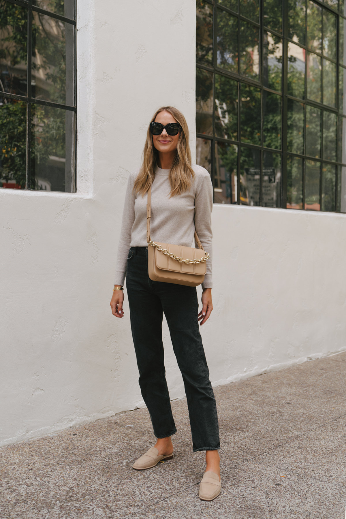 Fashion Jackson Wearing Beige Sweater Black Jeans Vince Camuto Beige Suede Mules Beige Crossbody Handbag