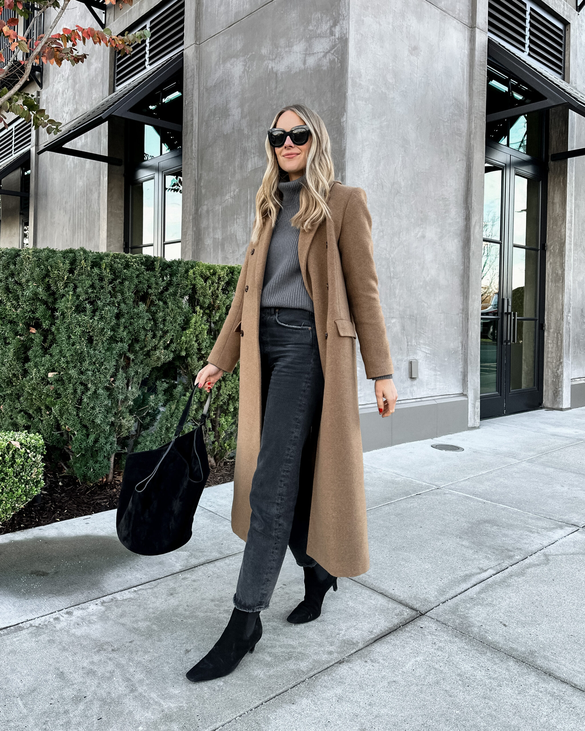 Fashion Jackson Wearing Camel Coat Jenni Kayne Grey Cashmere Turtleneck Sweater Black AGOLDE Jeans Toteme Black Boots Khaite Black Handbag Fall Outfit Winter Outfit