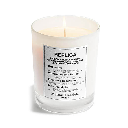 replica by the fireplace candle