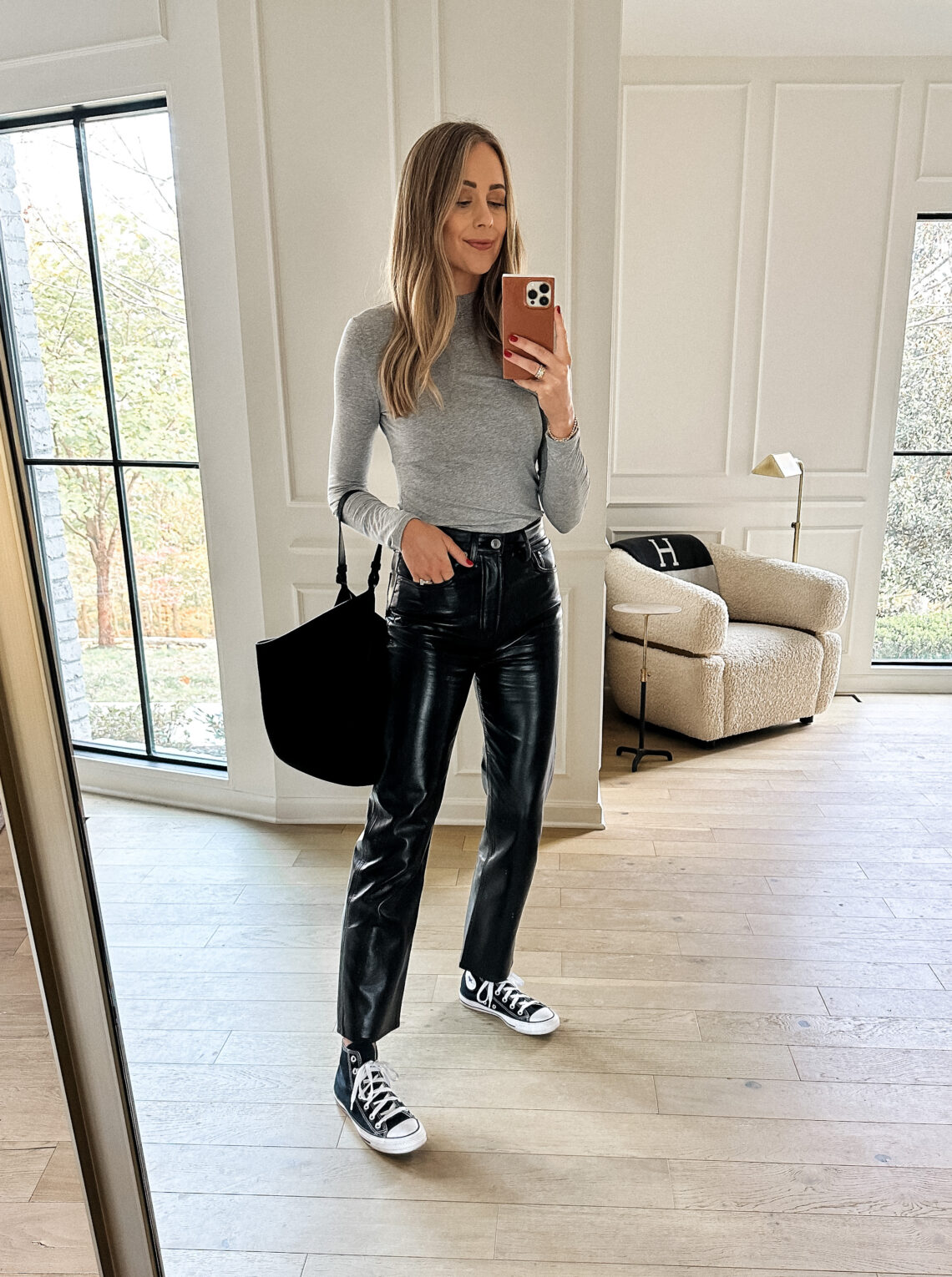 Fashion Jackson Wearing Grey Long Sleeve Mock Neck Top AGOLDE Recycled Leather Black Pants Converse Black High Top Sneakers Khaite Black Suede Lotus Handbag Casual Fall Outfit