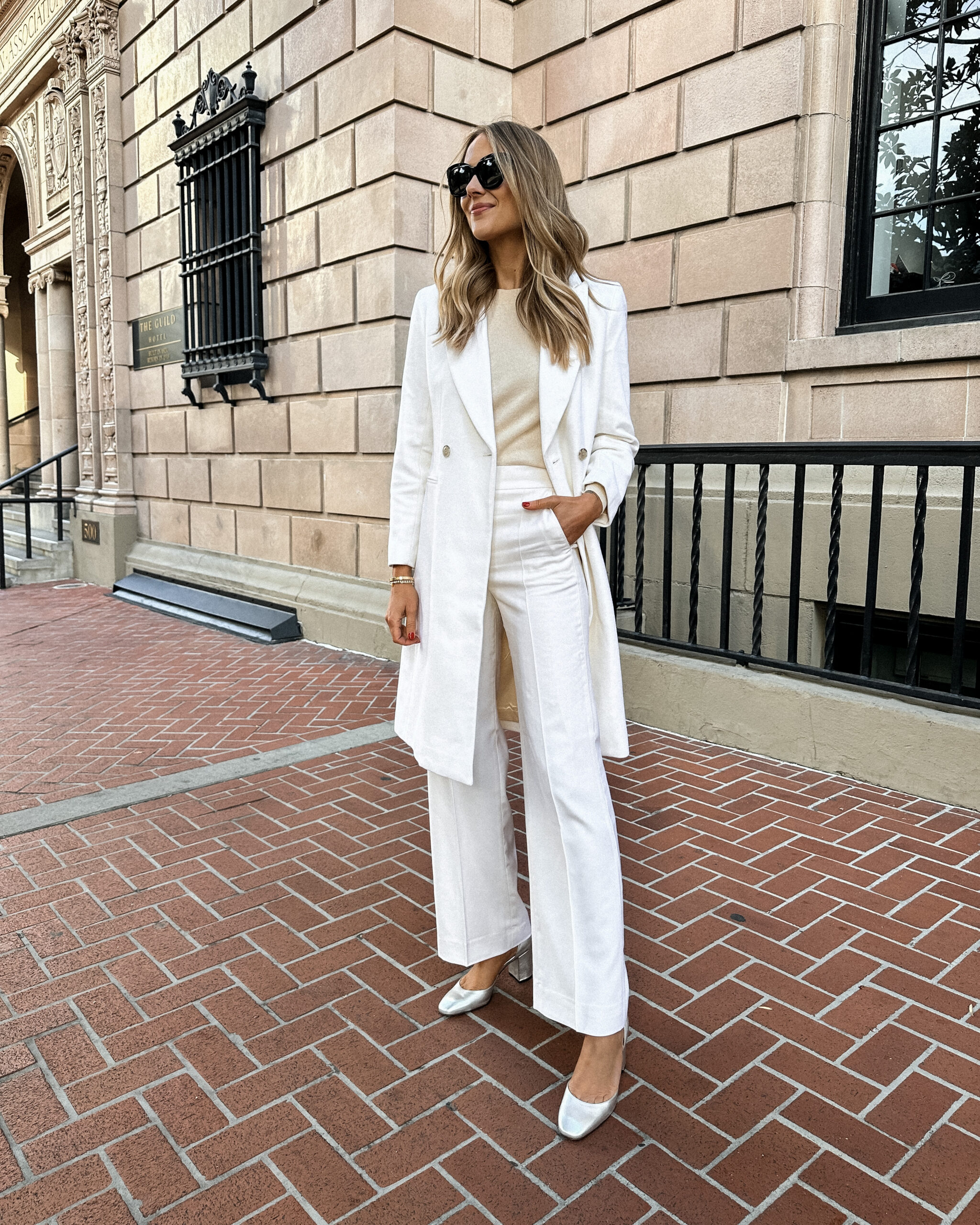 Fashion Jackson Wearing Jcrew White coat Beige Sweater White Wide Leg Pants Silver Pumps Holiday Outfit