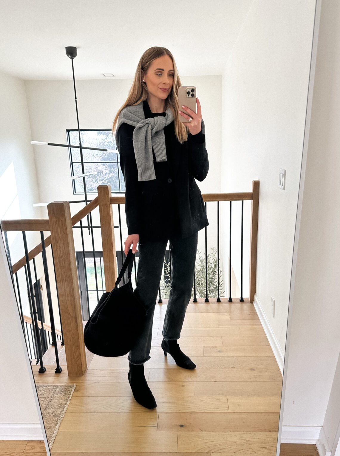Fashion Jackson Wearing Black Blazer Outfit AGOLDE Black Jeans Toteme Black Ankle Boots Grey Sweater Khaite Black Suede Lotus Handbag Fall Outfit Business Casual Outfit Winter Outfit