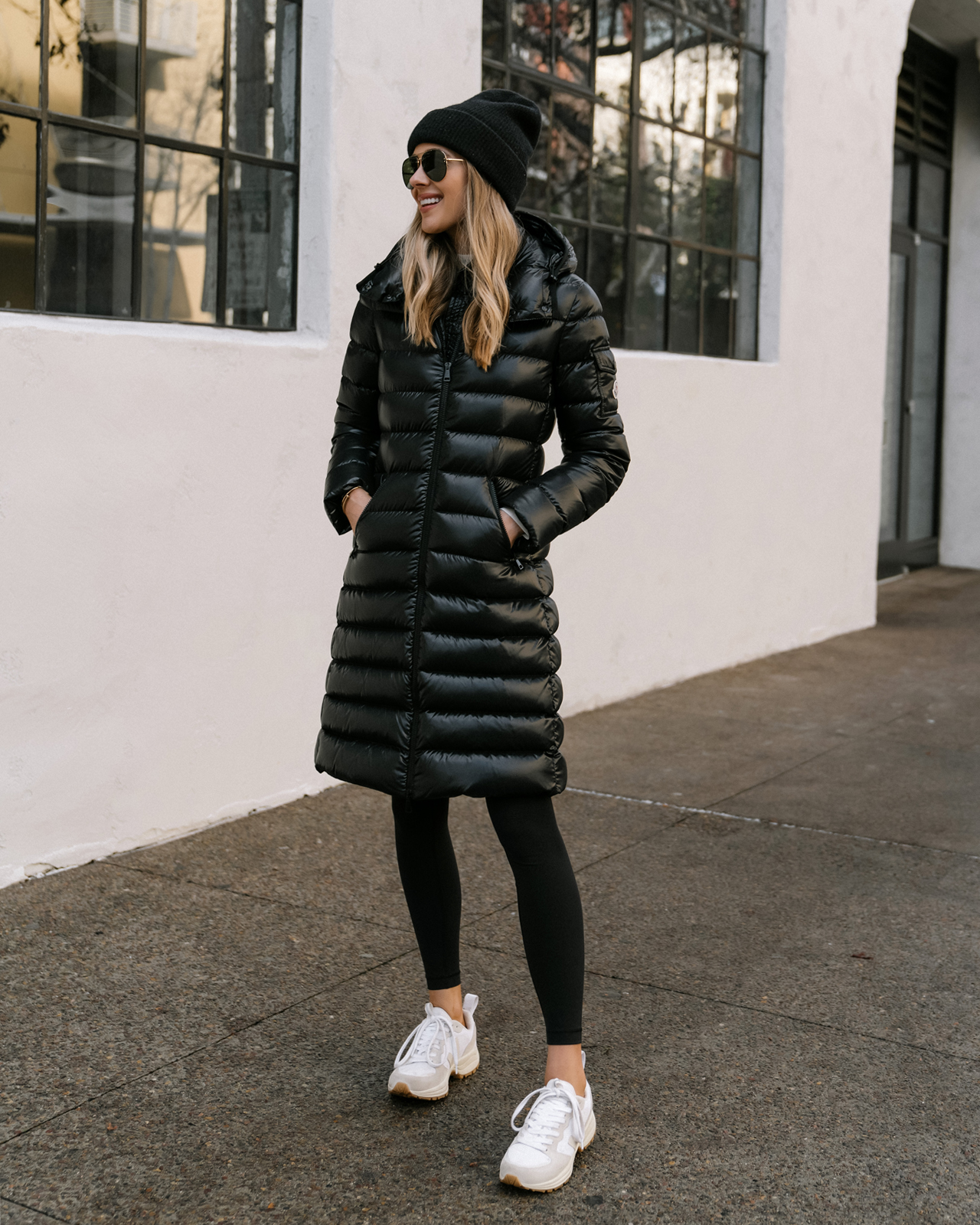 Fashion Jackson Wearing Black Moncler Moka Quilted Down Long Parka Black Leggings Veja Venturi Sneakers Black Beanie Celine Aviator Sunglasses Winter Coat Street Style 1