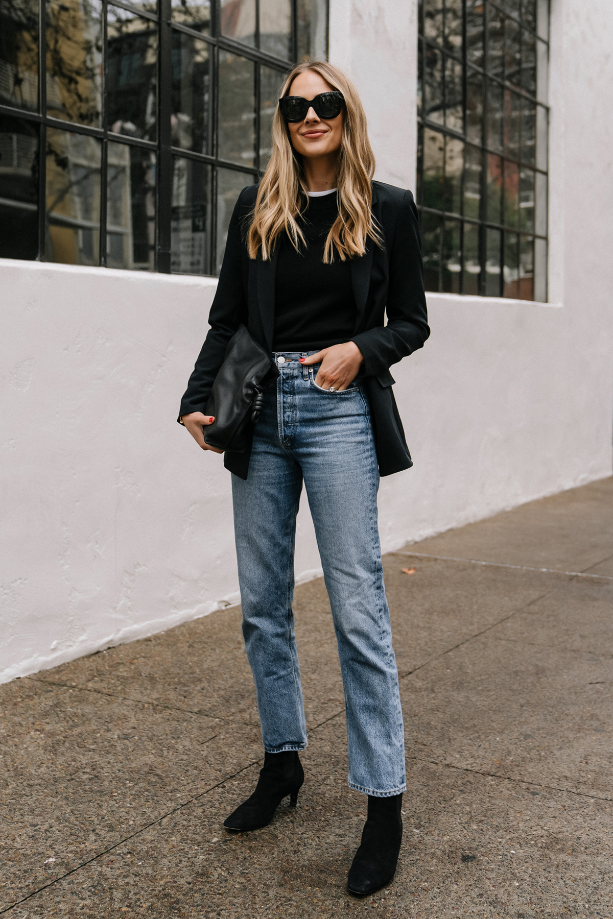 Fashion Jackson Wearing Black Blazer White Tshirt Black Sweater AGOLDE 90s Jeans Toteme Black Booties Loewe Black Handbag business casual outfit with jeans and boots Street Style