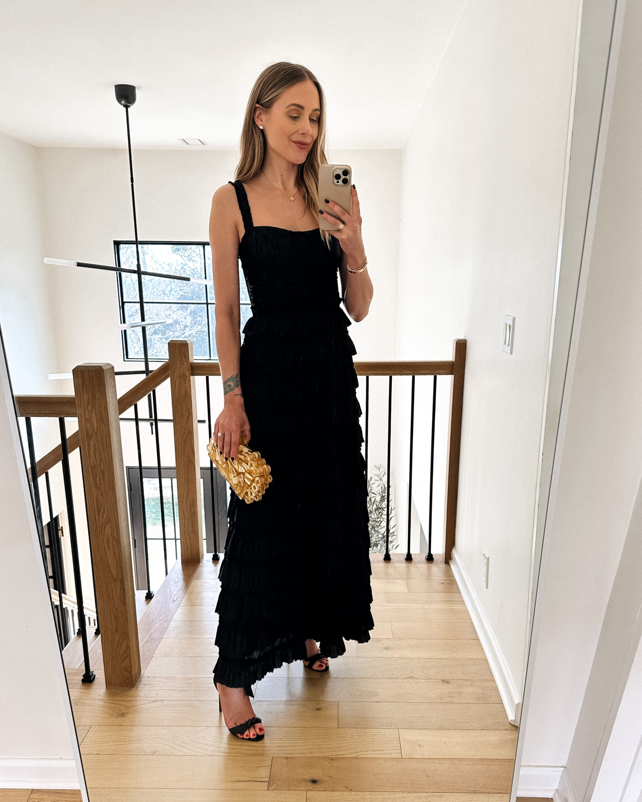 https://fashionjackson.com/wp-content/uploads/2023/03/Fashion-Jackson-Wearing-Ulla-Johnson-Camille-Ruffled-Satin-Gown-Black-Heeled-Sandals-Gold-Clutch-Wedding-Guest-Dress-scaled.jpg