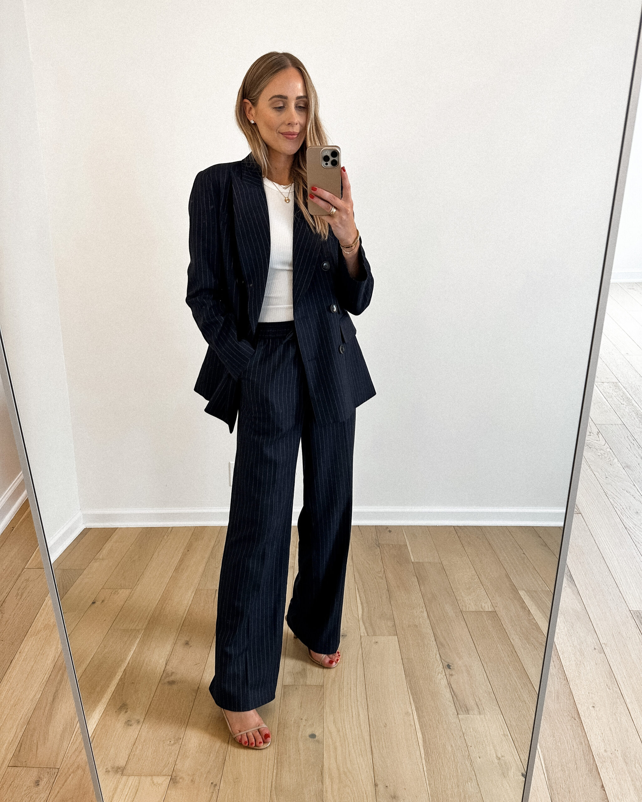 Fashion Jackson Wearing MAYSON the label Navy Pinstripe Double Breasted Blazer, White Tank, Navy Pinstripe Drawstring Pants, Nude Strappy Sandals, Workwear Outfit Idea