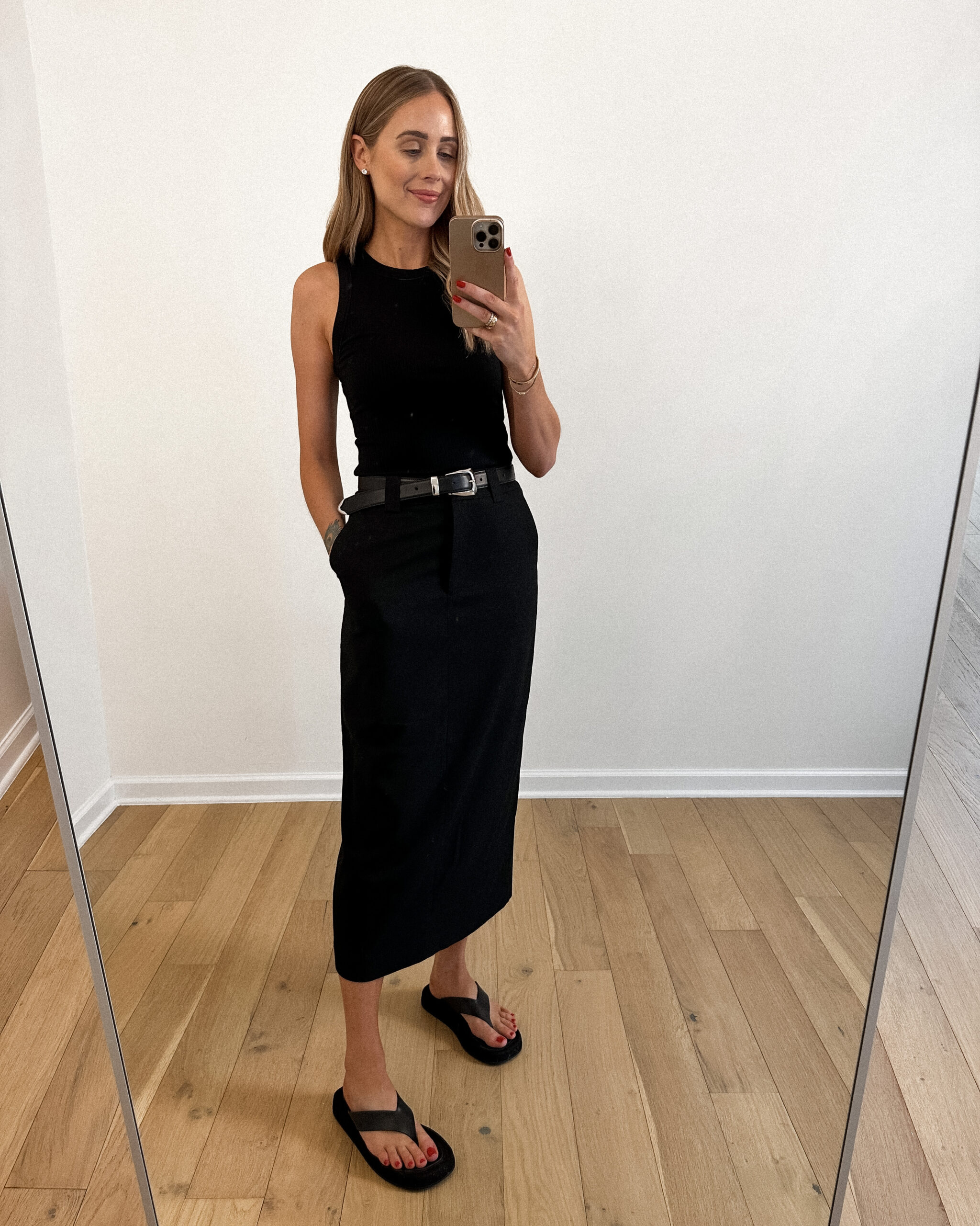 Fashion Jackson Wearing MAYSON the label Black Fitted Tank, Black Column Maxi Skirt, Khaite Black Benny Belt, The Row Ginza black leather suede sandals, casual outfit