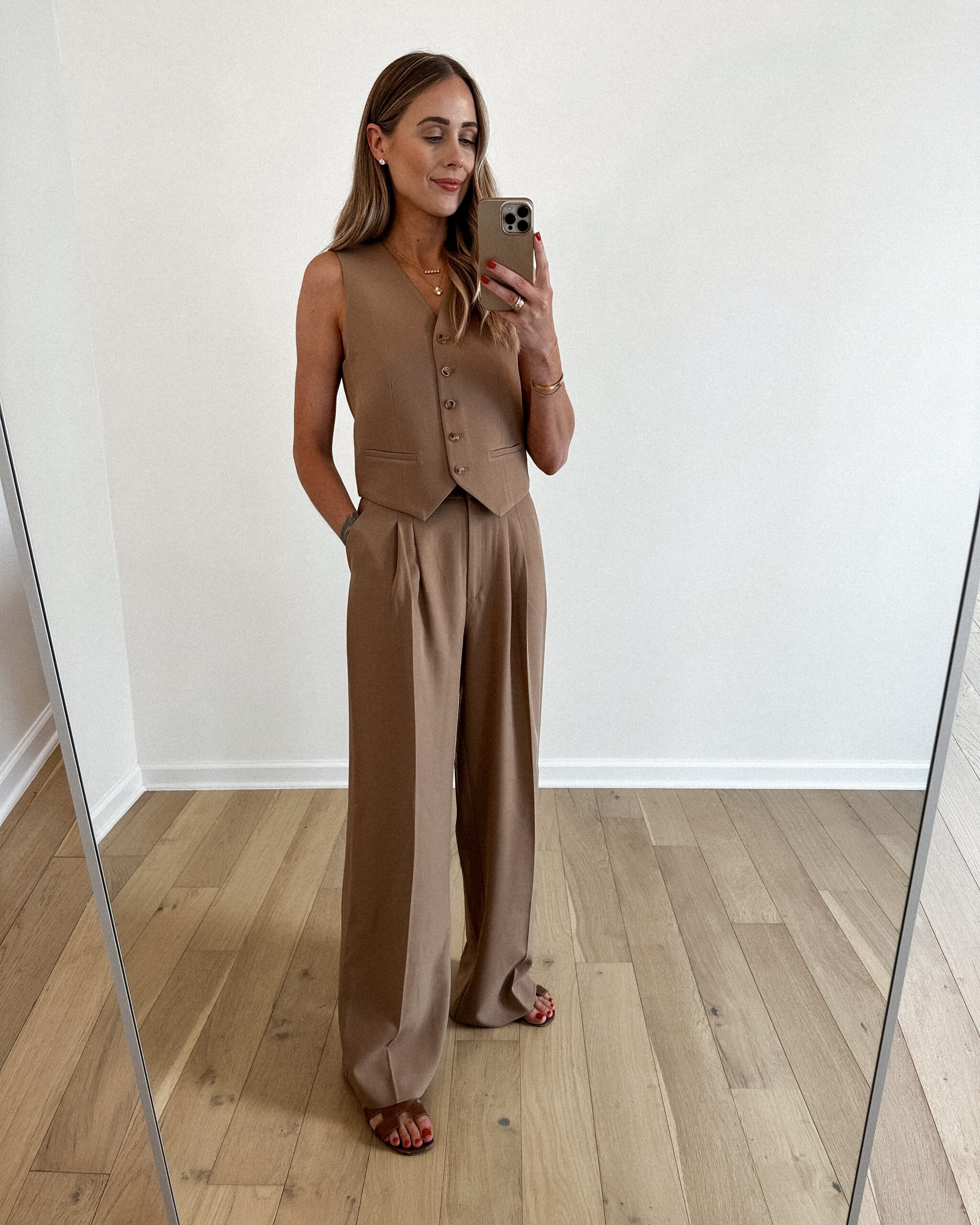 Fashion Jackson Wearing MAYSON the label camel vest, Camel wide leg trousers, Hermes Oran Gold Sandals, Business casual workwear outfit idea