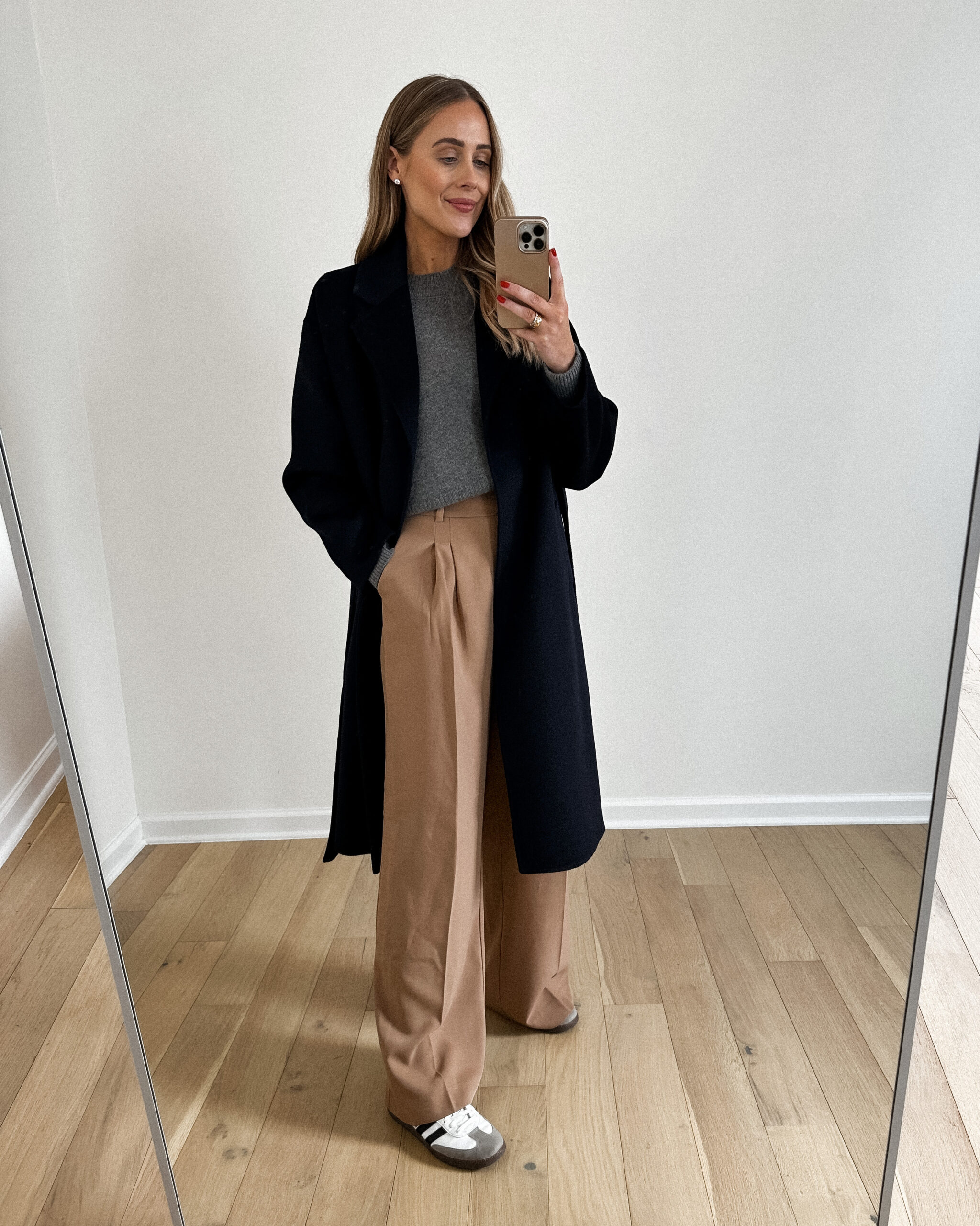 Fashion Jackson Wearing Navy Wool Cashmere Double Faced Wrap Coat, Grey Sweater, Camel Wide Leg Trousers, Adidas samba sneakers, dressy casual outfit