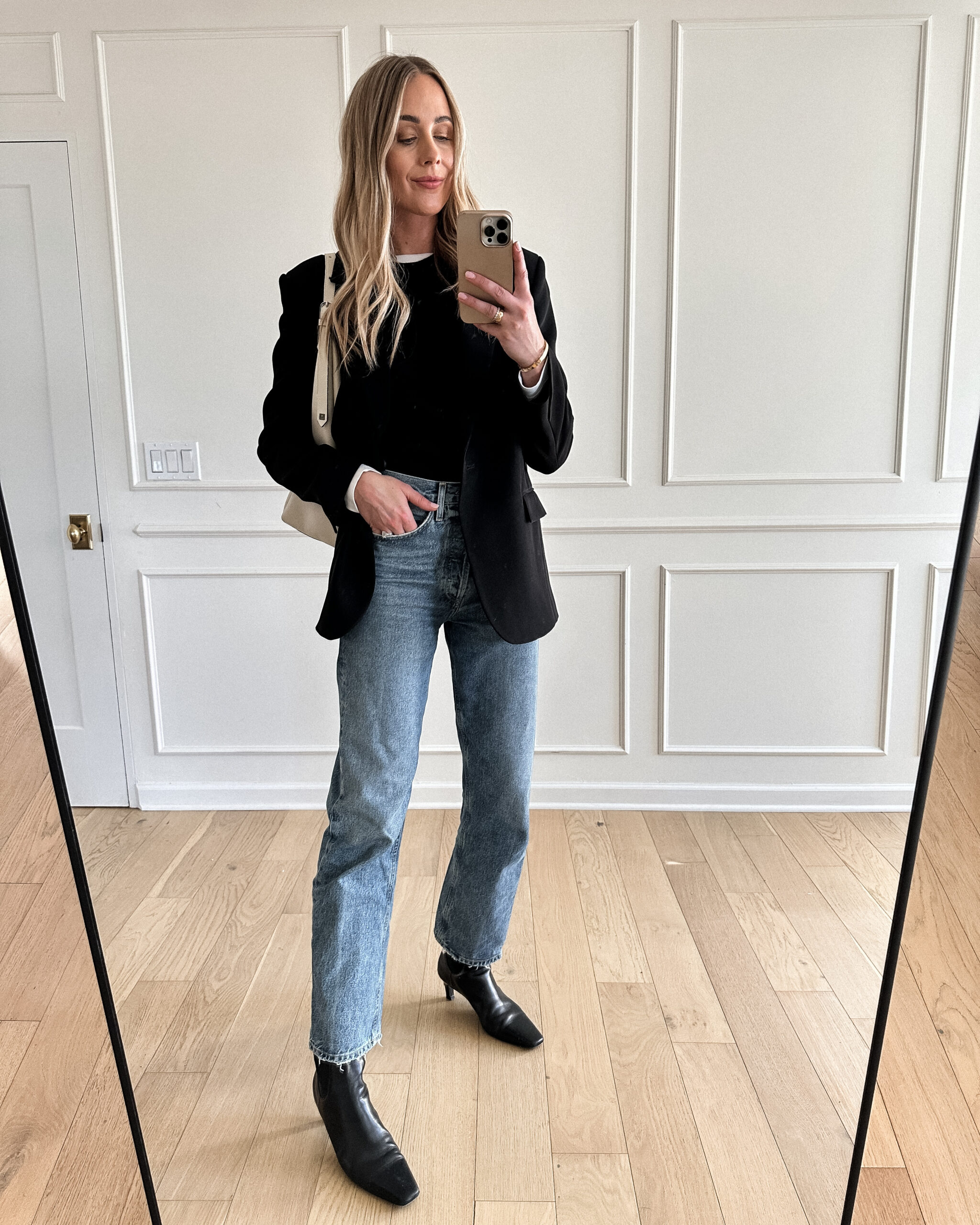 Fashion Jackson Wearing MAYSON the label black boyfriend blazer, black sweater, agolde jeans, toteme black booties, black blazer and jeans outfit, casual workwear outfit for women, black blazer outfit inspo,